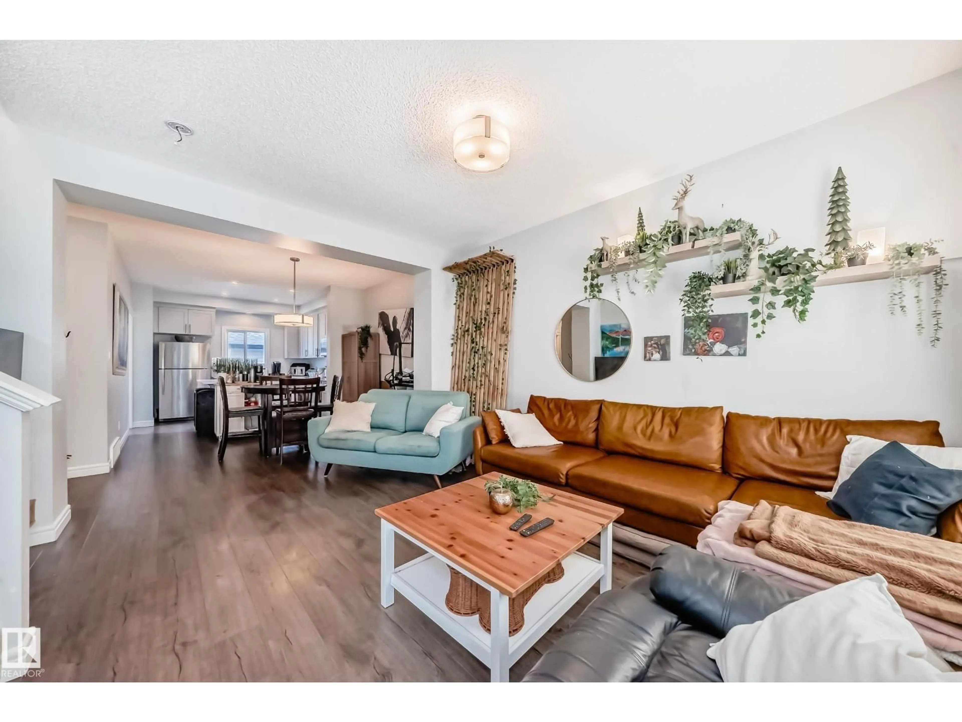 Living room with furniture, wood/laminate floor for 2 SOUTHPOINTE BV, Fort Saskatchewan Alberta T8L0T9