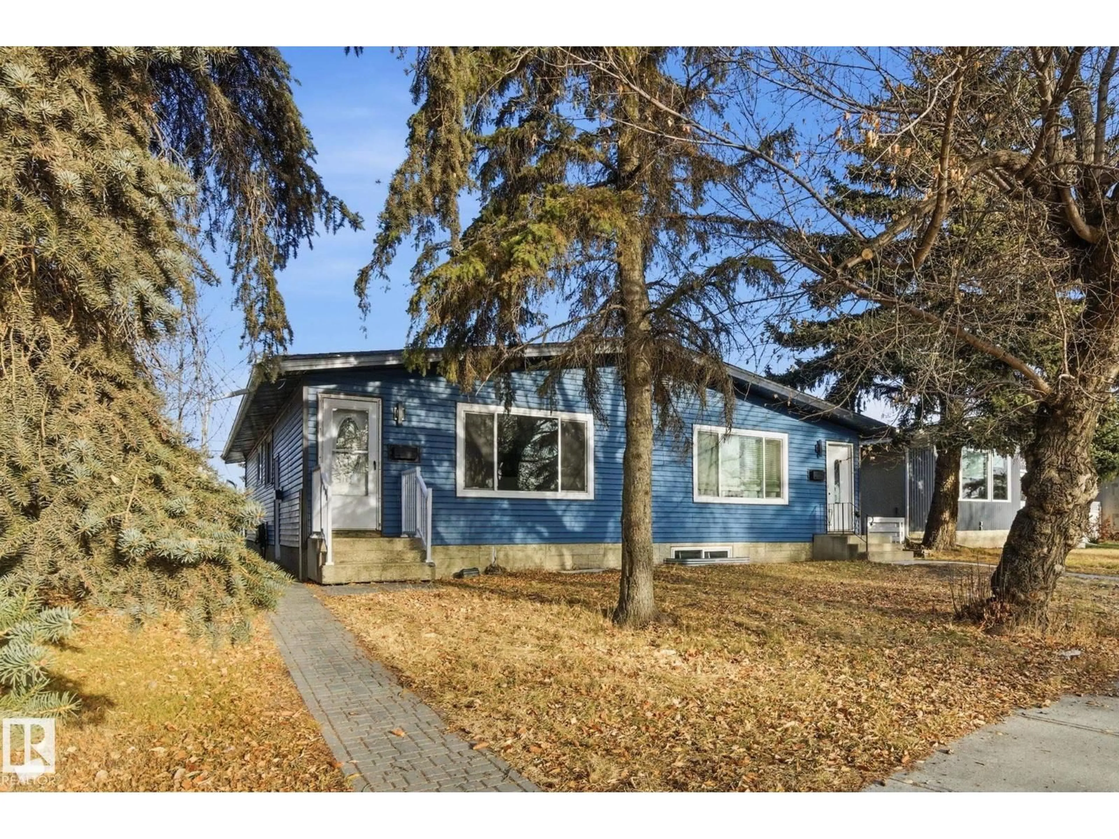 Home with vinyl exterior material, street for 8064 ARGYLL RD, Edmonton Alberta T6C4B1