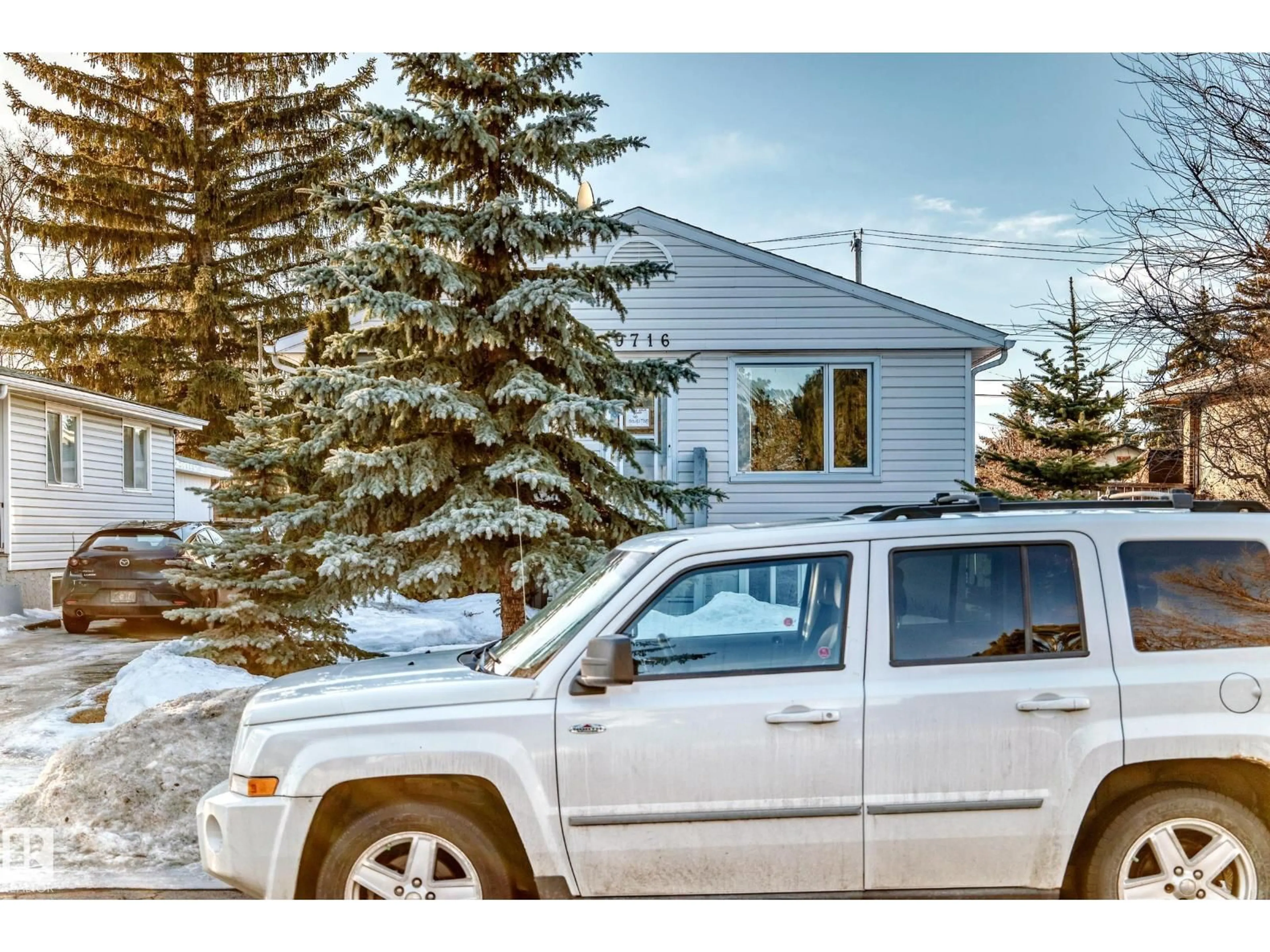 Home with vinyl exterior material, street for 9716 162 ST, Edmonton Alberta T5Y2Y9