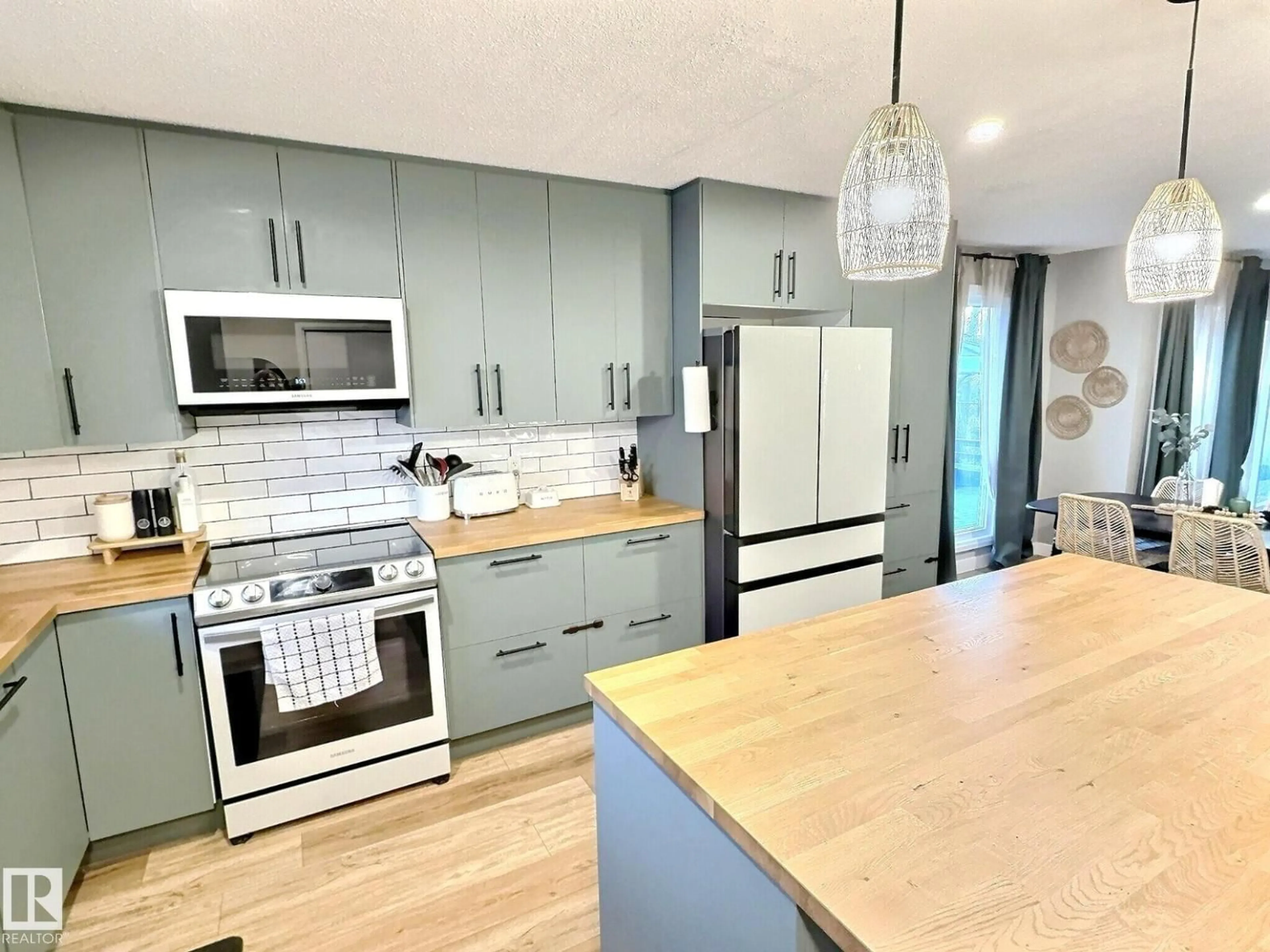 Open concept kitchen, wood/laminate floor for 17119 82 AV, Edmonton Alberta T5T0C2