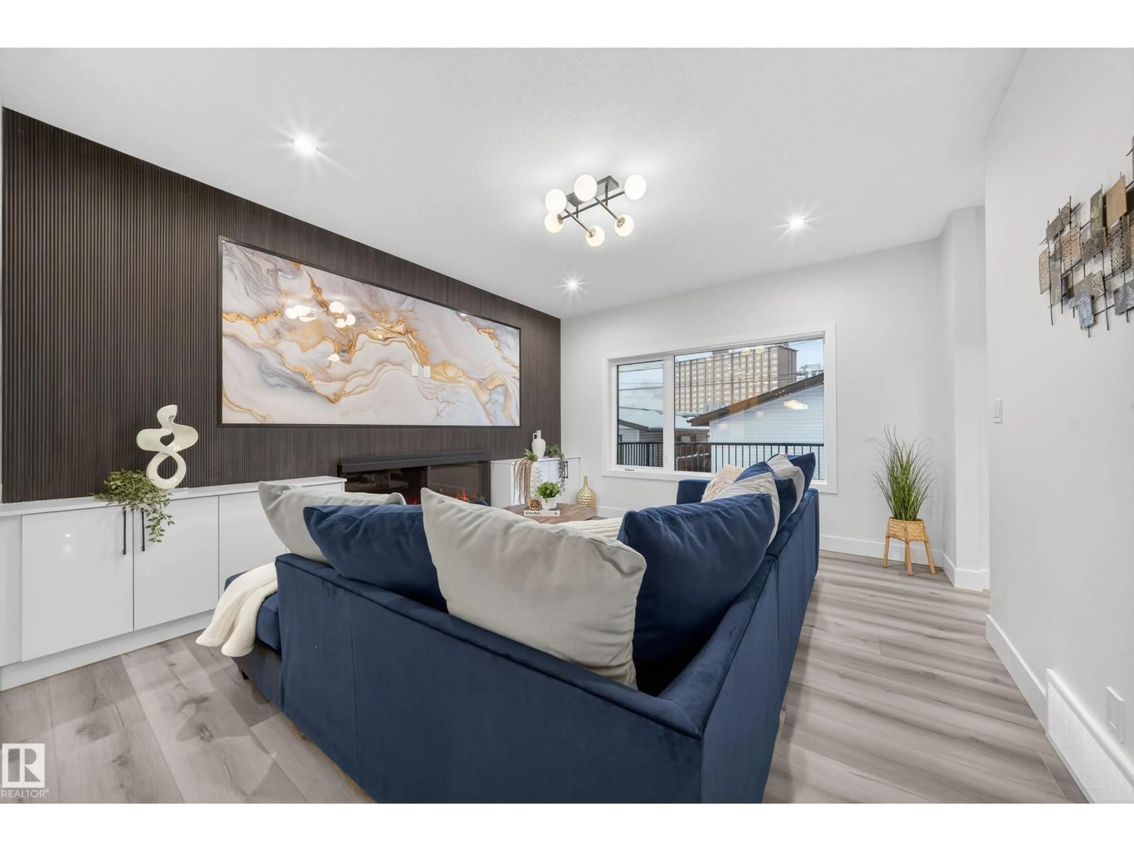 Living room with furniture, wood/laminate floor for 9909 68 ST, Edmonton Alberta T6A2S6