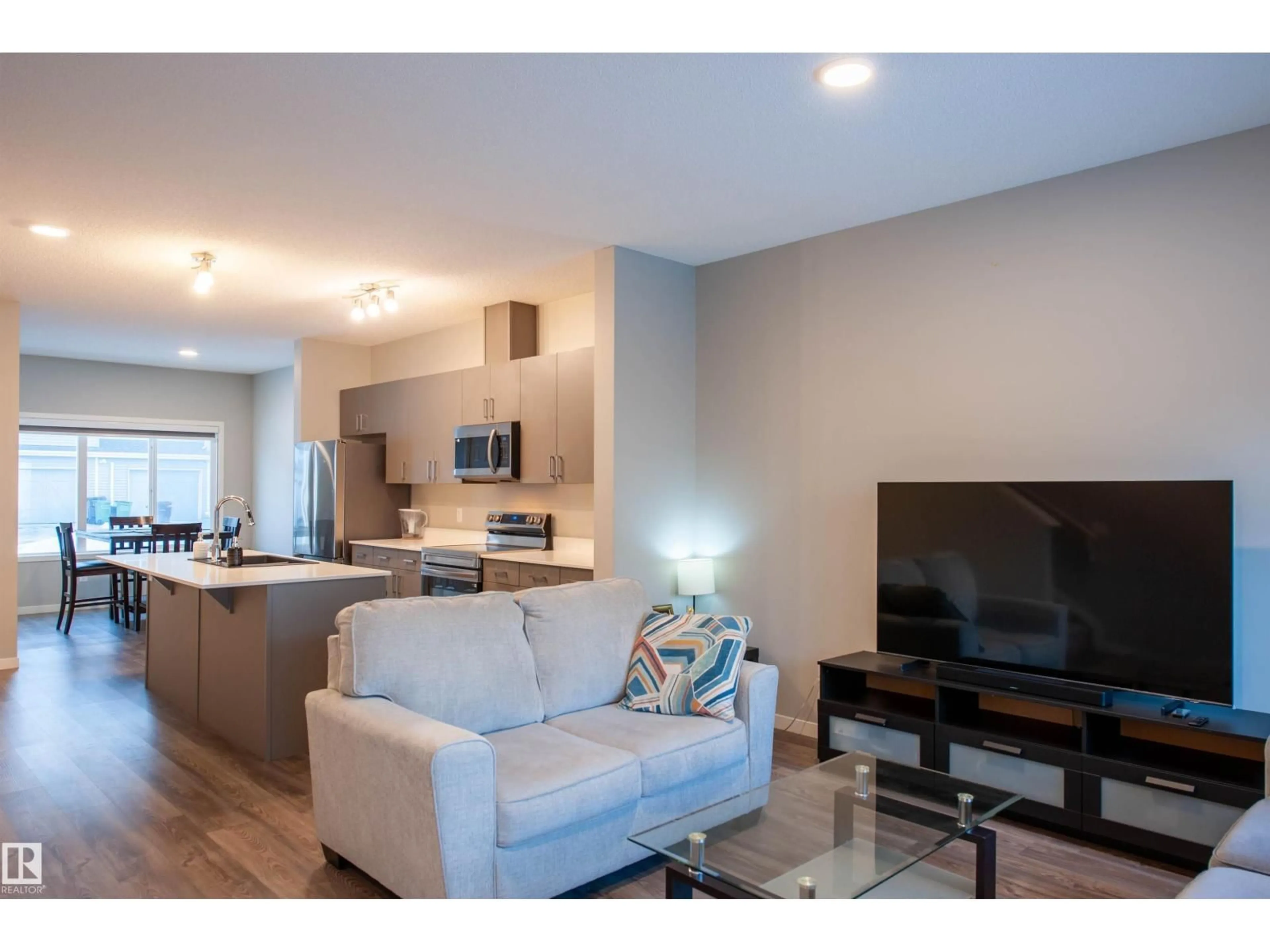 Living room with furniture, unknown for 1527 16 AV, Edmonton Alberta T6T2N9