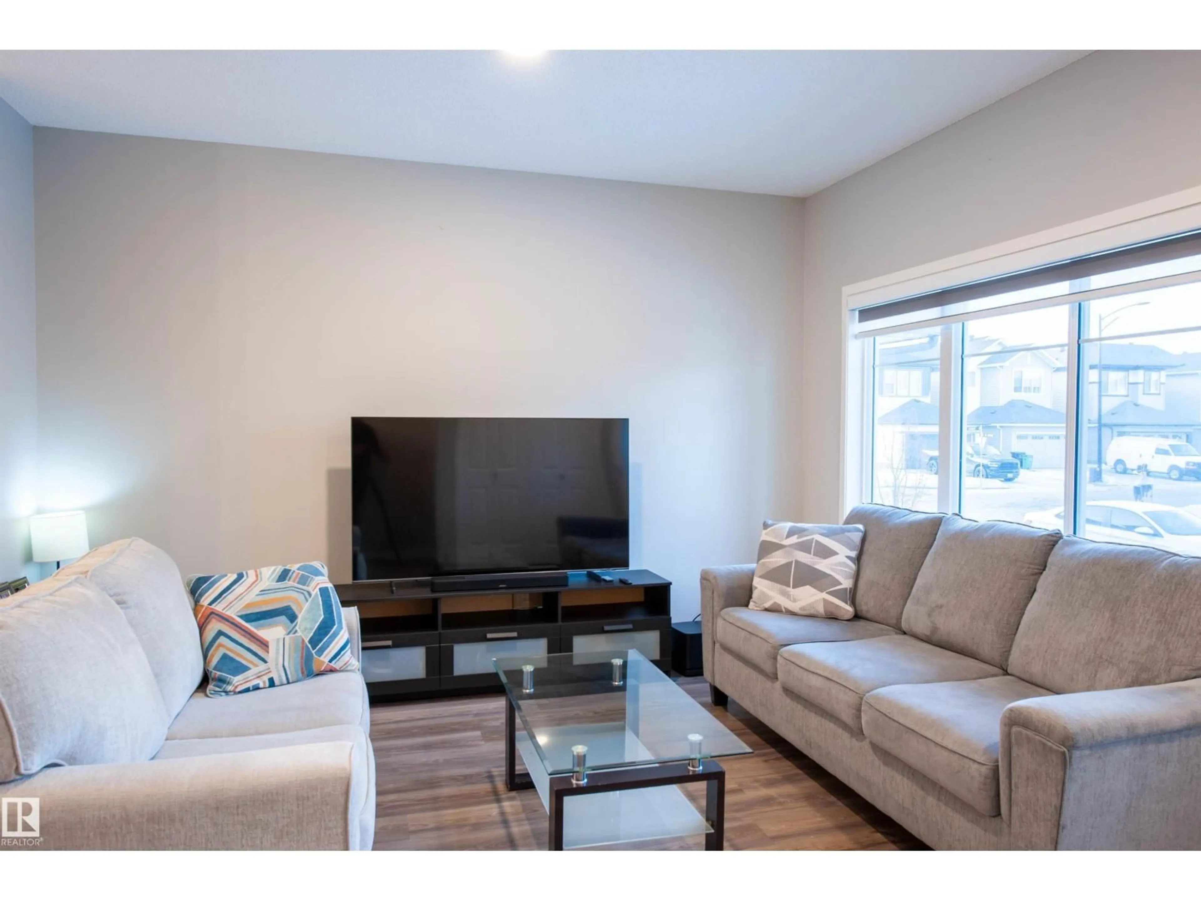 Living room with furniture, wood/laminate floor for 1527 16 AV, Edmonton Alberta T6T2N9
