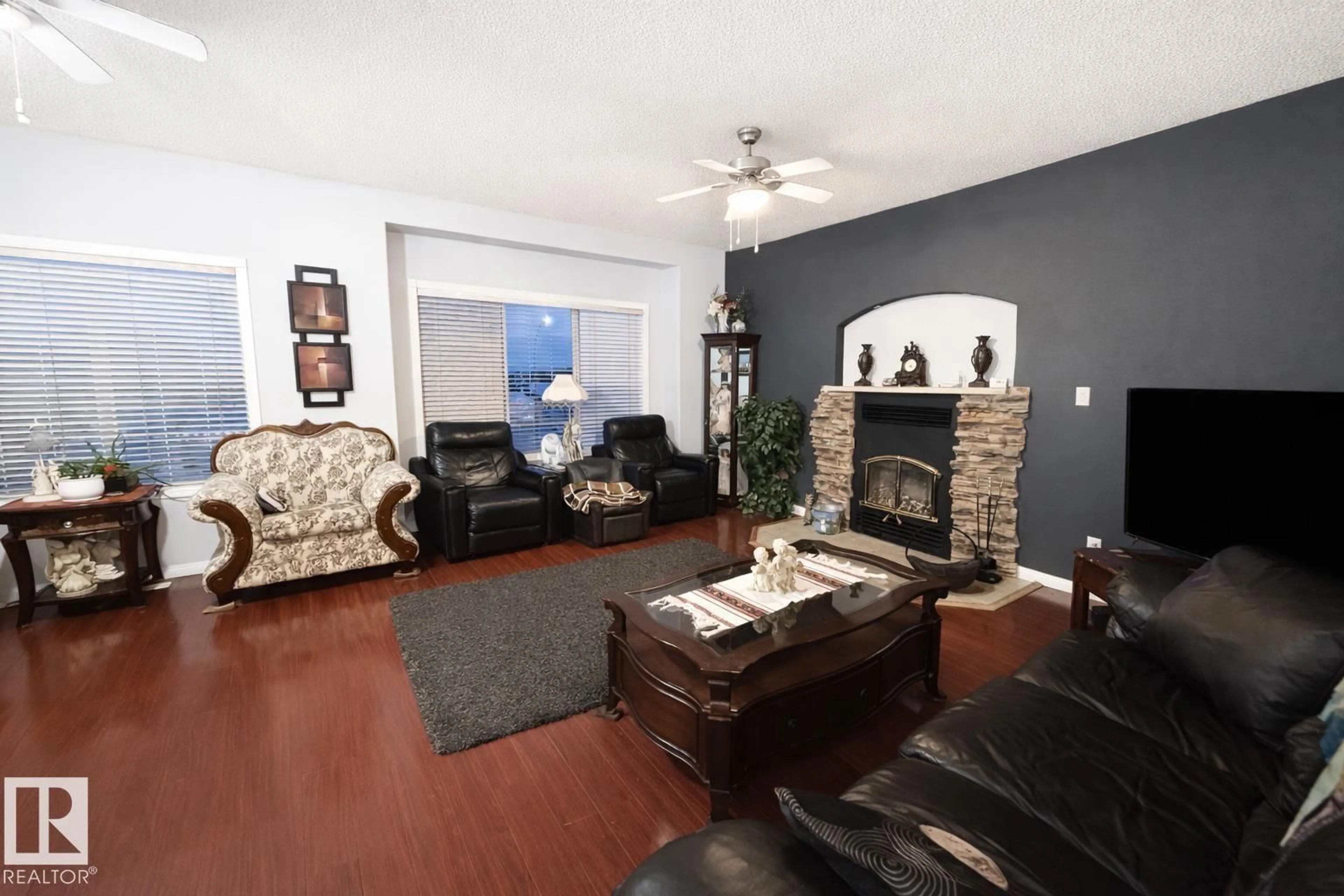 Living room with furniture, wood/laminate floor for 5119 46 AV, Mundare Alberta T0B3H0