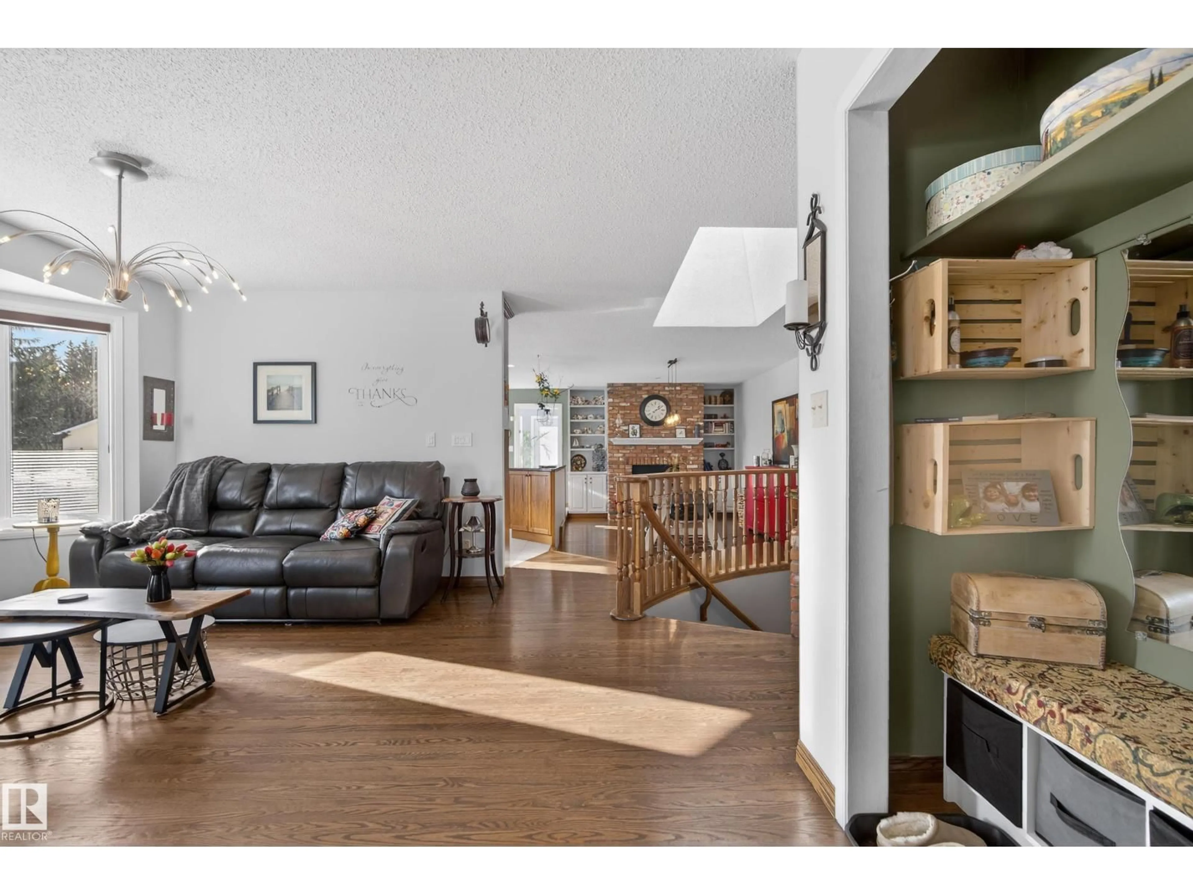 Living room with furniture, wood/laminate floor for 60 GLENCOE PL, Sherwood Park Alberta T8A5L2