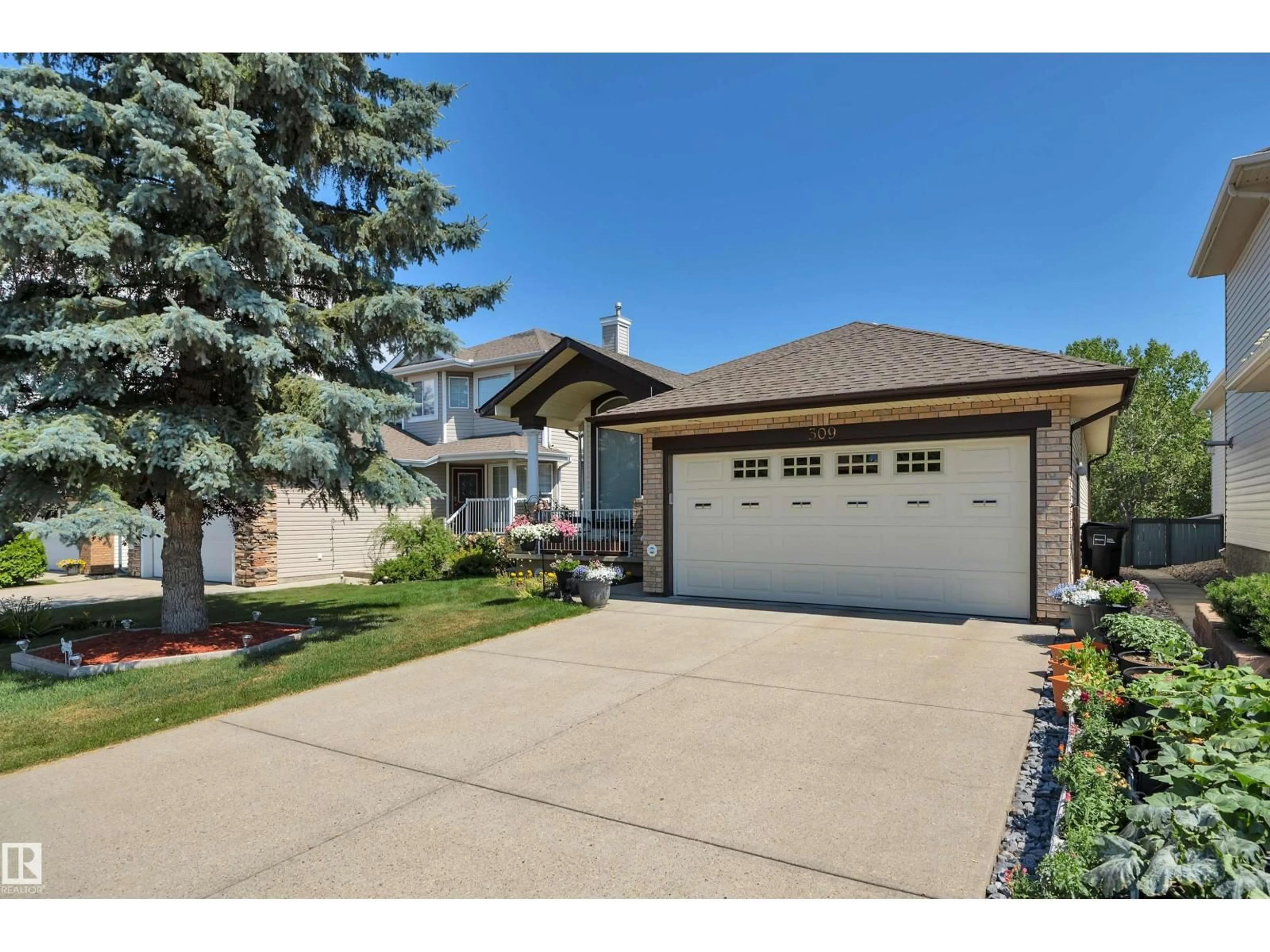 Home with vinyl exterior material, street for 309 BYRNE CT, Edmonton Alberta T6W1E2