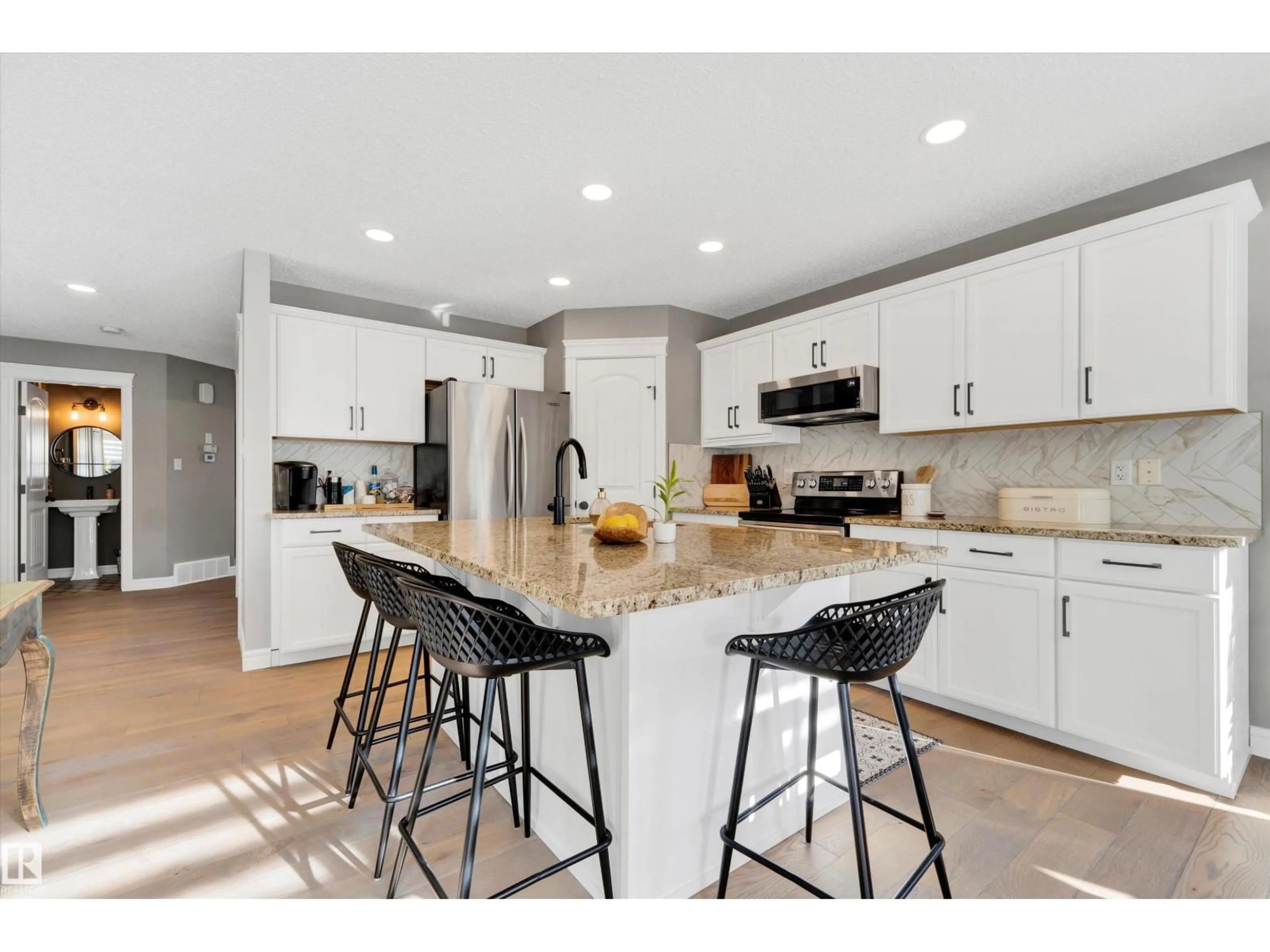 Open concept kitchen, ceramic/tile floor for SW - 17437 5A AV, Edmonton Alberta T6W2E3