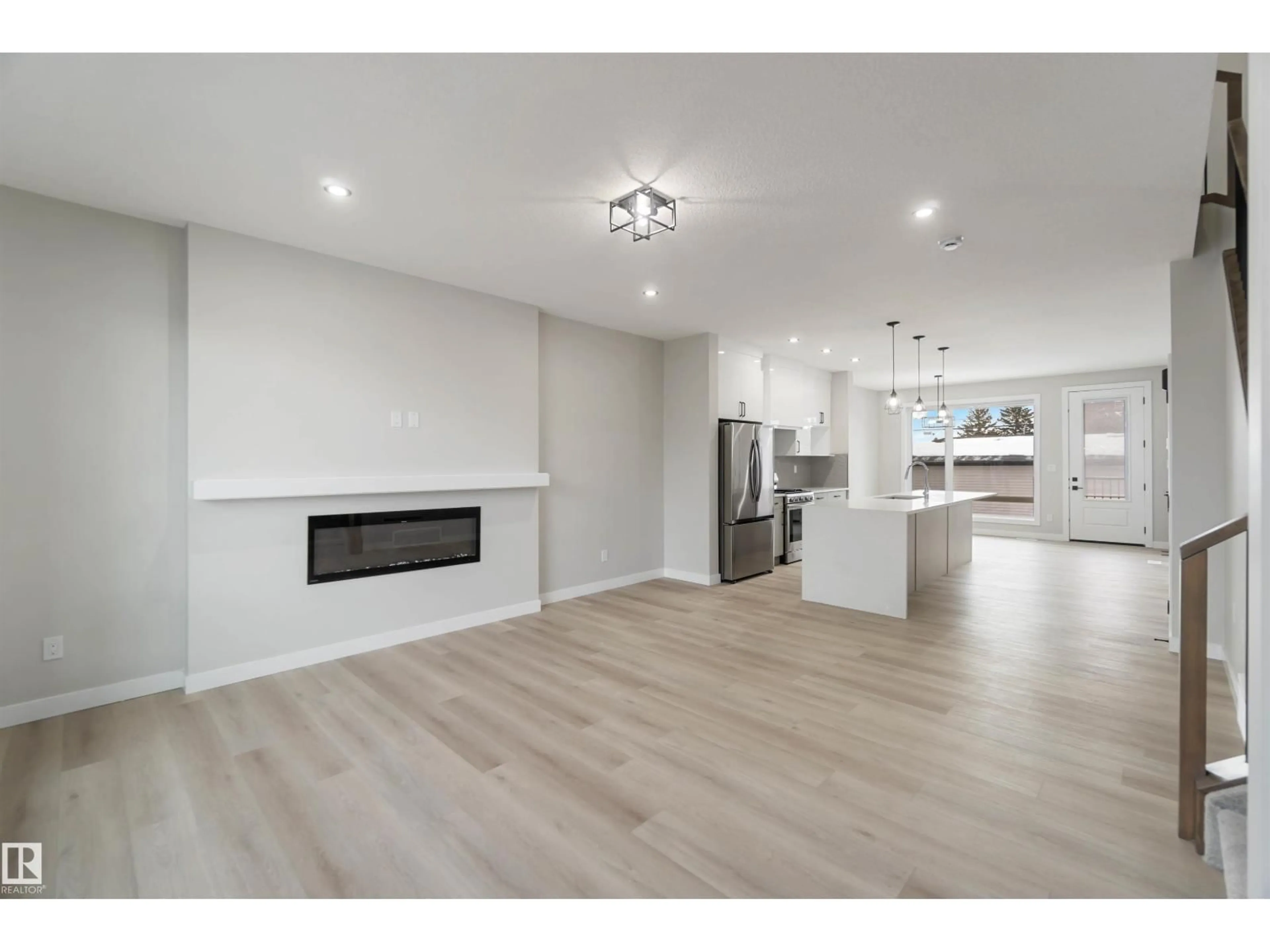 Open concept kitchen, wood/laminate floor for NW - 9145 154 ST, Edmonton Alberta T5R1T2