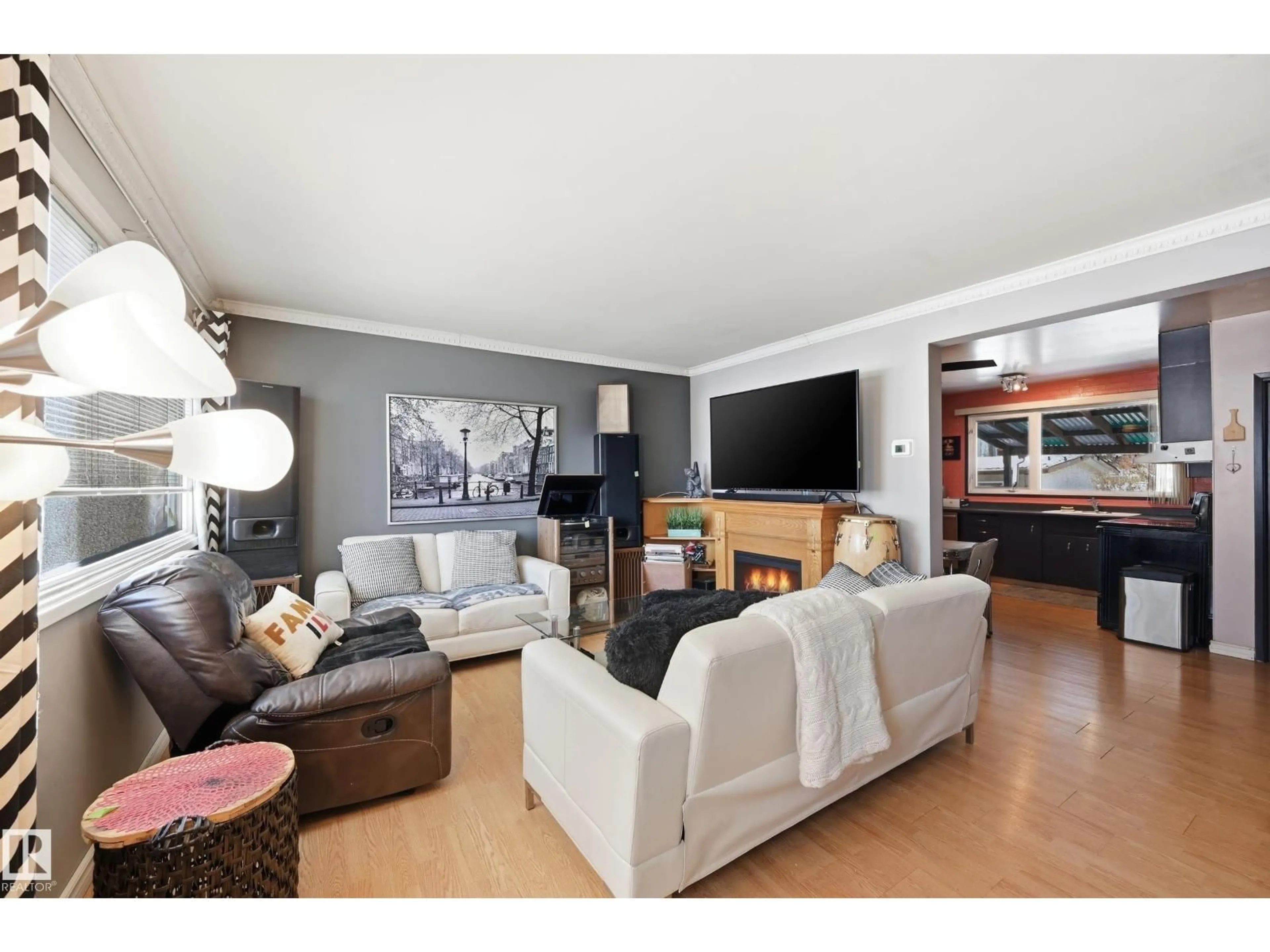 Living room with furniture, wood/laminate floor for 13314 108 ST, Edmonton Alberta T5E4X5