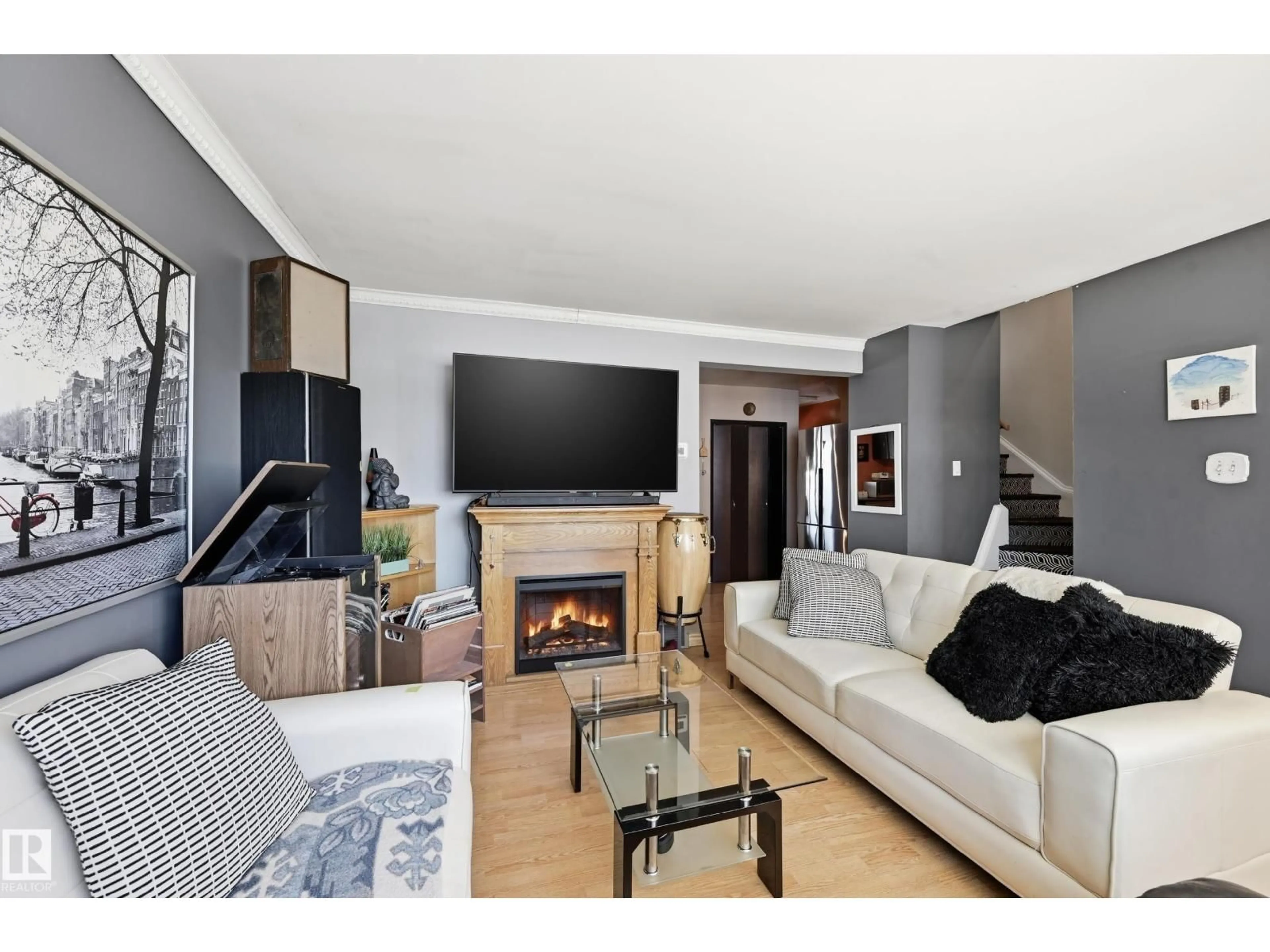 Living room with furniture, wood/laminate floor for 13314 108 ST, Edmonton Alberta T5E4X5