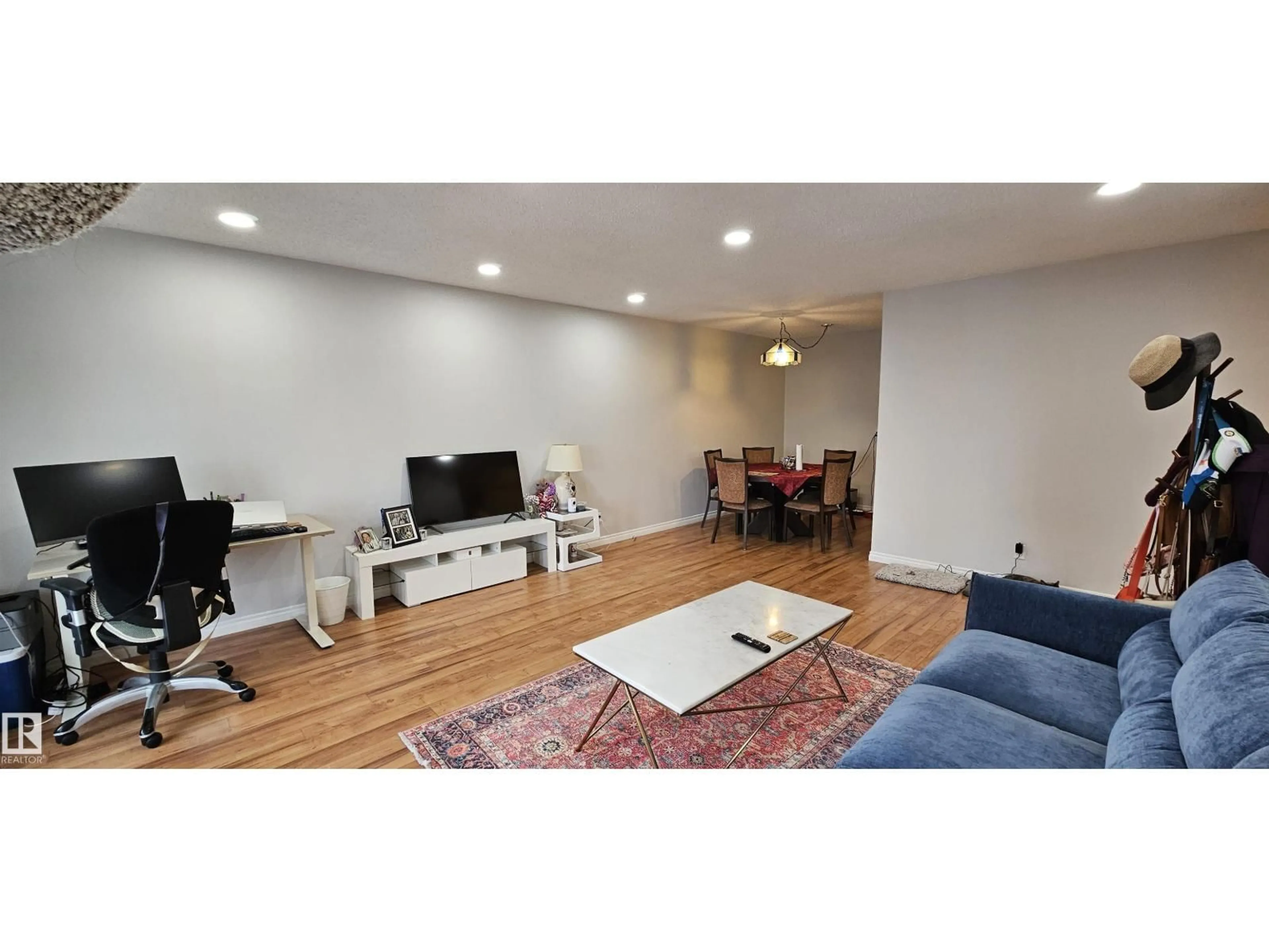 Living room with furniture, wood/laminate floor for 906 - 11307 99 AV, Edmonton Alberta T5K0H2