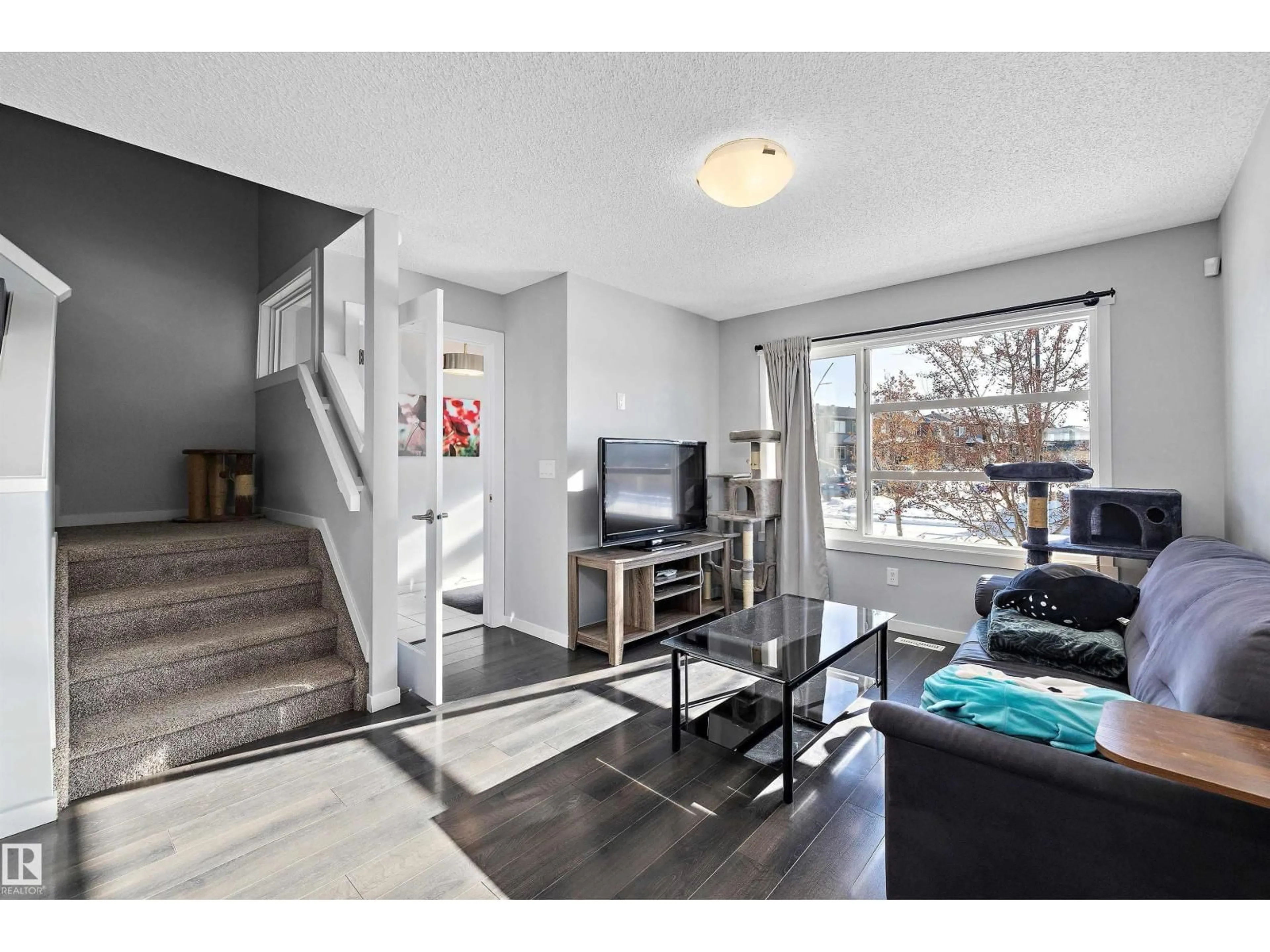 Living room with furniture, unknown for NW - 20106 27 AV, Edmonton Alberta T6M0W7