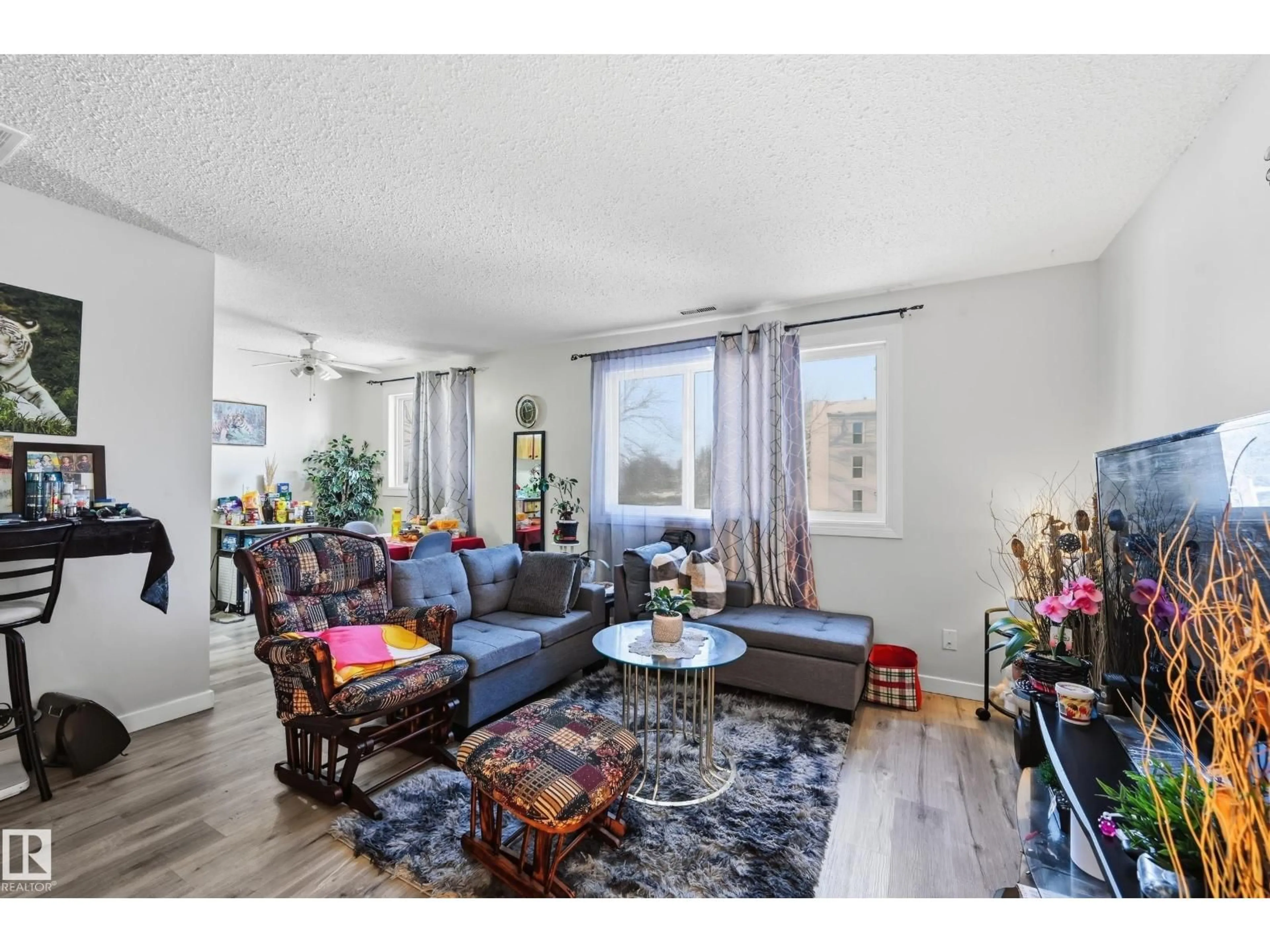 Living room with furniture, wood/laminate floor for 1482 LAKEWOOD RD, Edmonton Alberta T6K3M2