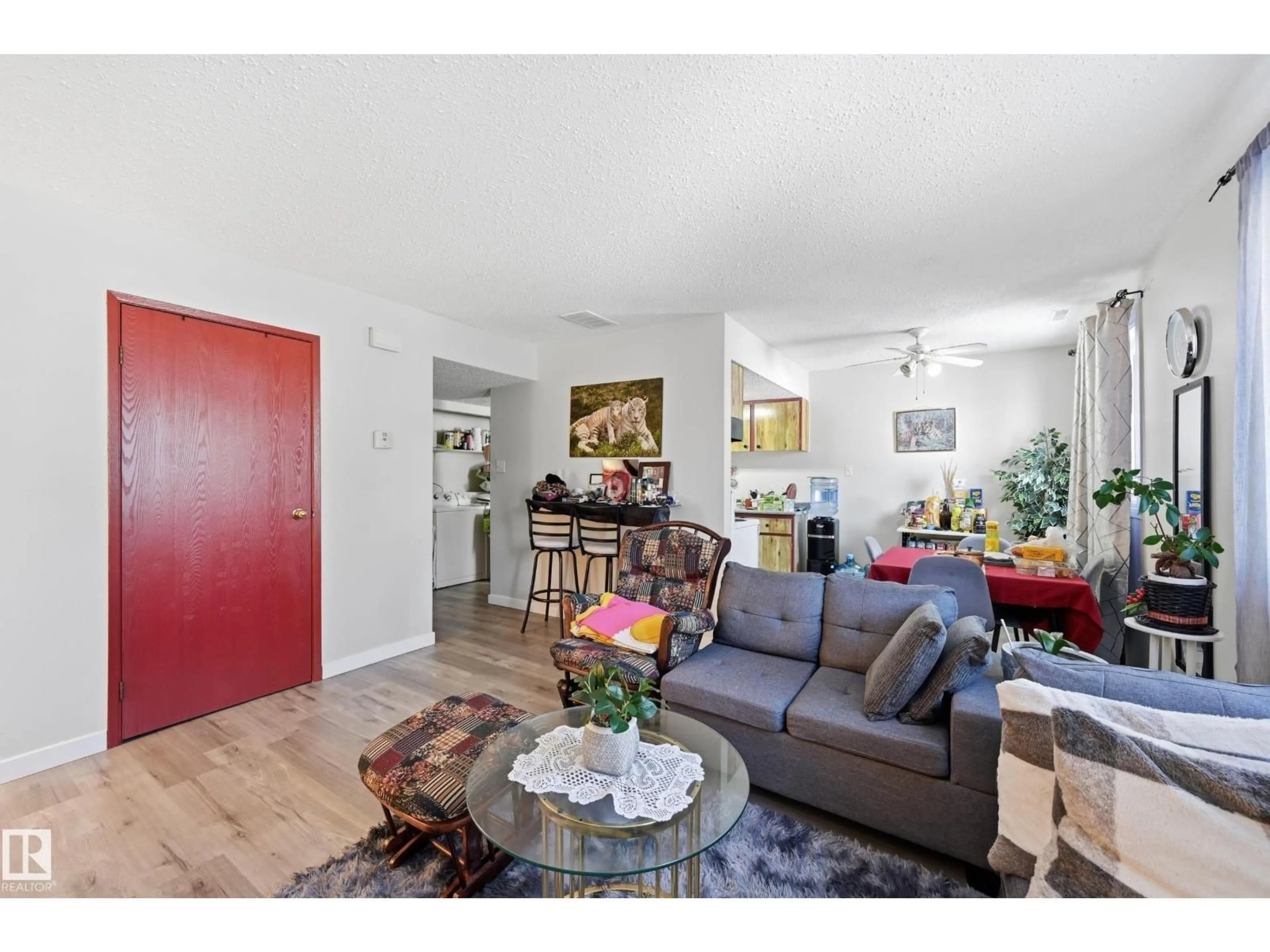 Living room with furniture, wood/laminate floor for 1482 LAKEWOOD RD, Edmonton Alberta T6K3M2