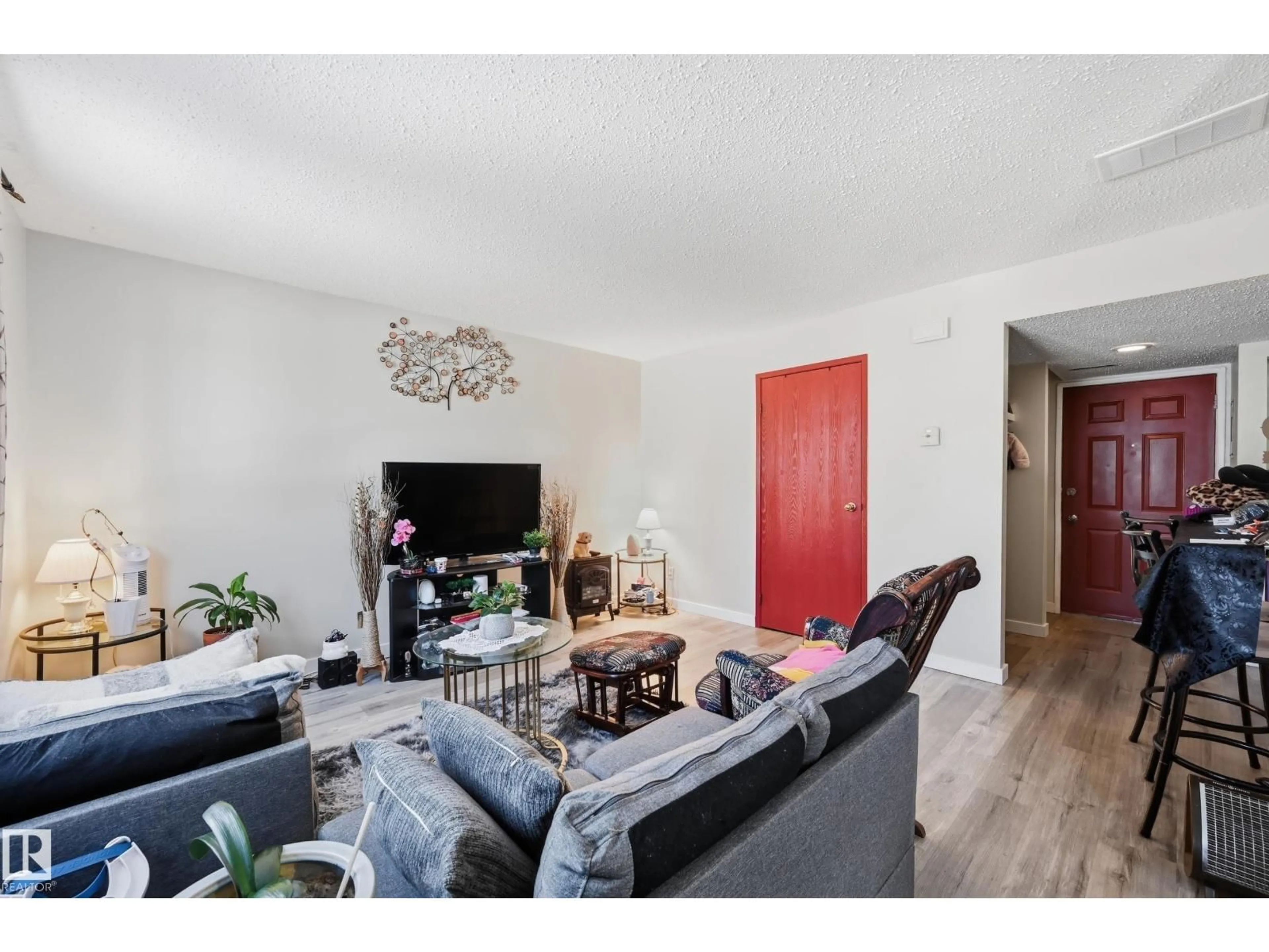 Living room with furniture, wood/laminate floor for 1482 LAKEWOOD RD, Edmonton Alberta T6K3M2