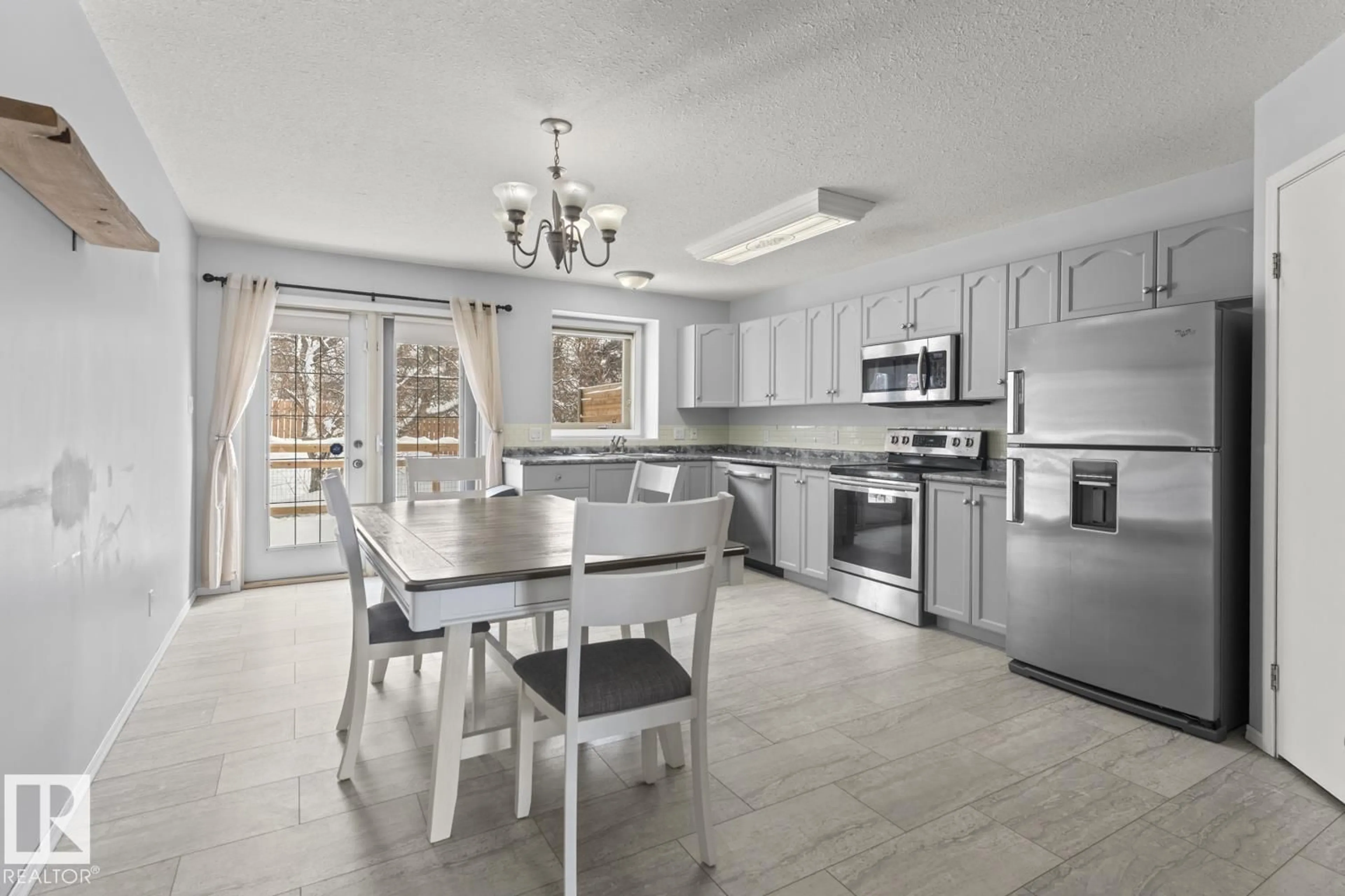 Open concept kitchen, ceramic/tile floor for 1006 11 ST, Cold Lake Alberta T9M1J1