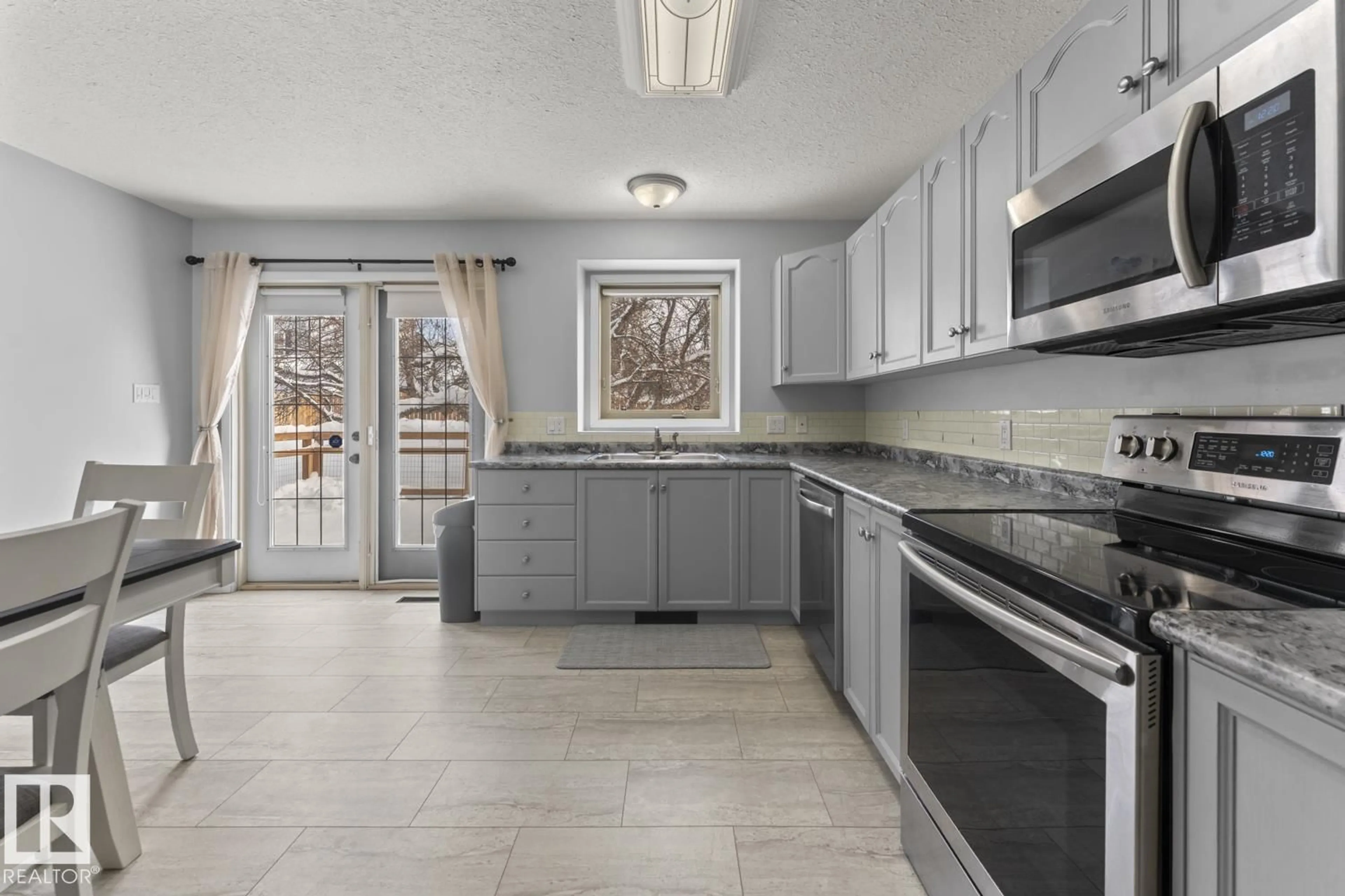 Open concept kitchen, ceramic/tile floor for 1006 11 ST, Cold Lake Alberta T9M1J1