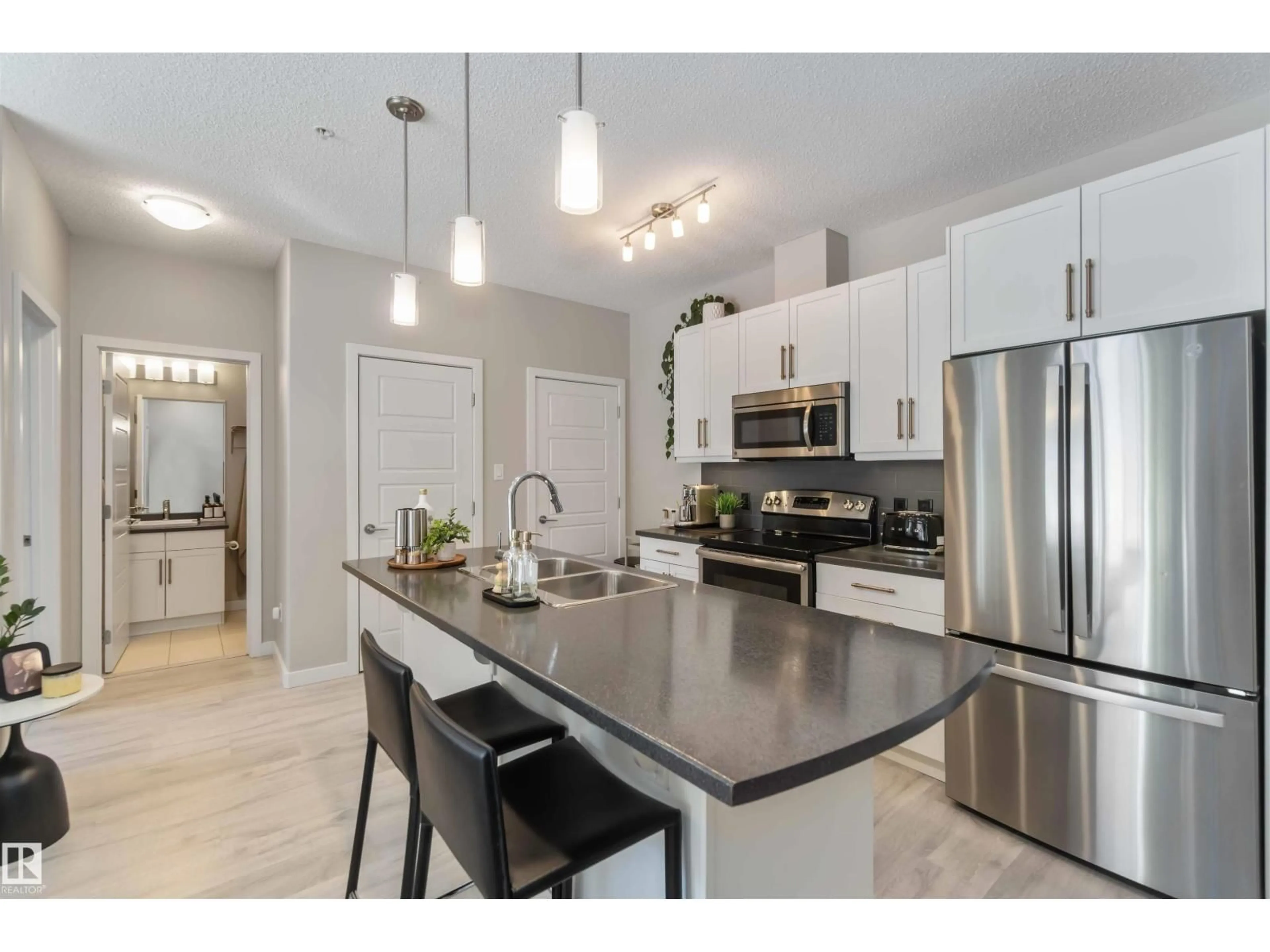 Open concept kitchen, unknown for #103 - 320 AMBLESIDE LINK, Edmonton Alberta T6W2Z9