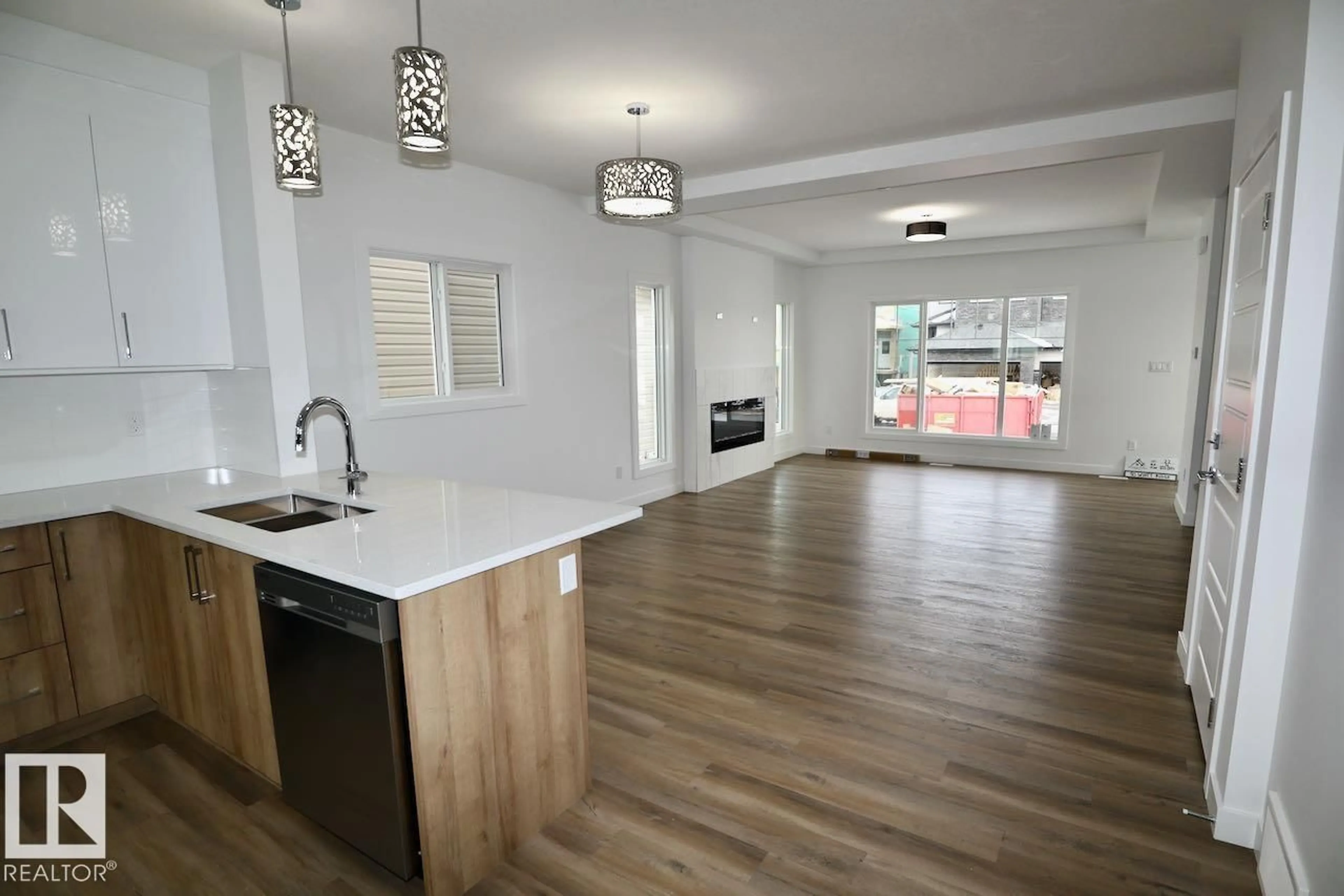 Open concept kitchen, wood/laminate floor for 90 WYATT RG, Fort Saskatchewan Alberta T8L0Y3