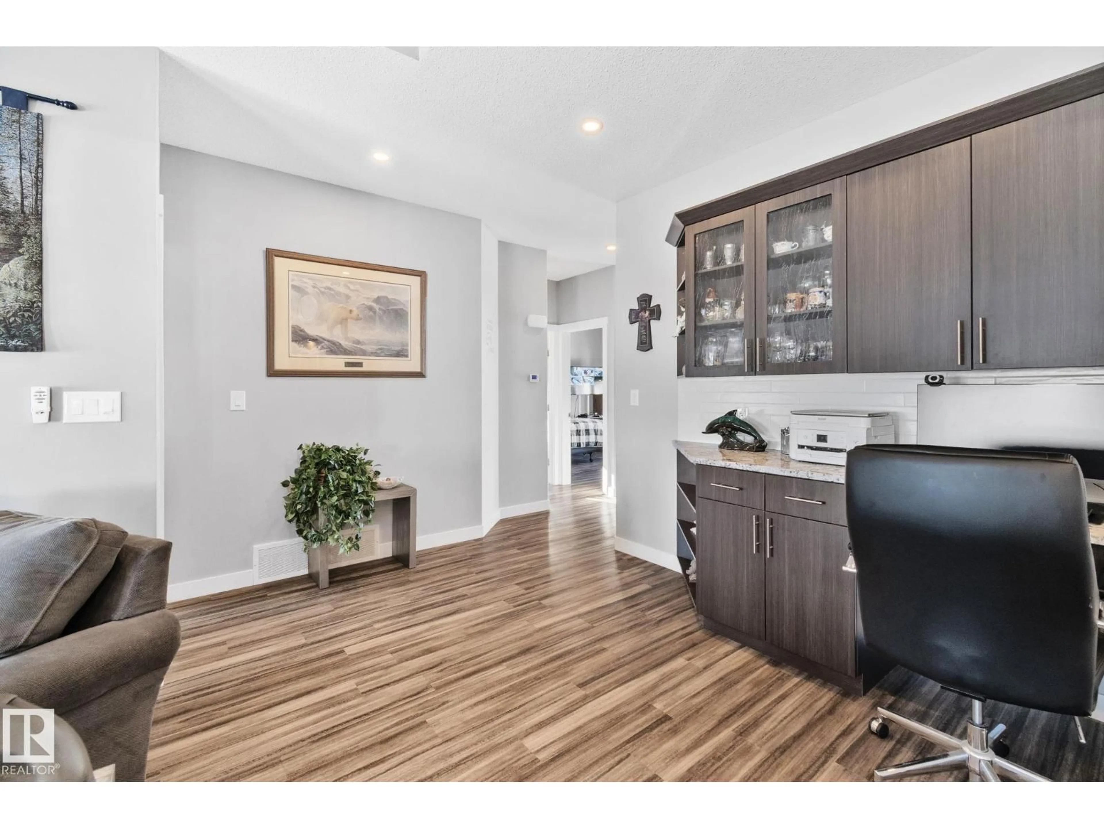 Open concept kitchen, wood/laminate floor for 105 HOULE DR, Morinville Alberta T8R0E1