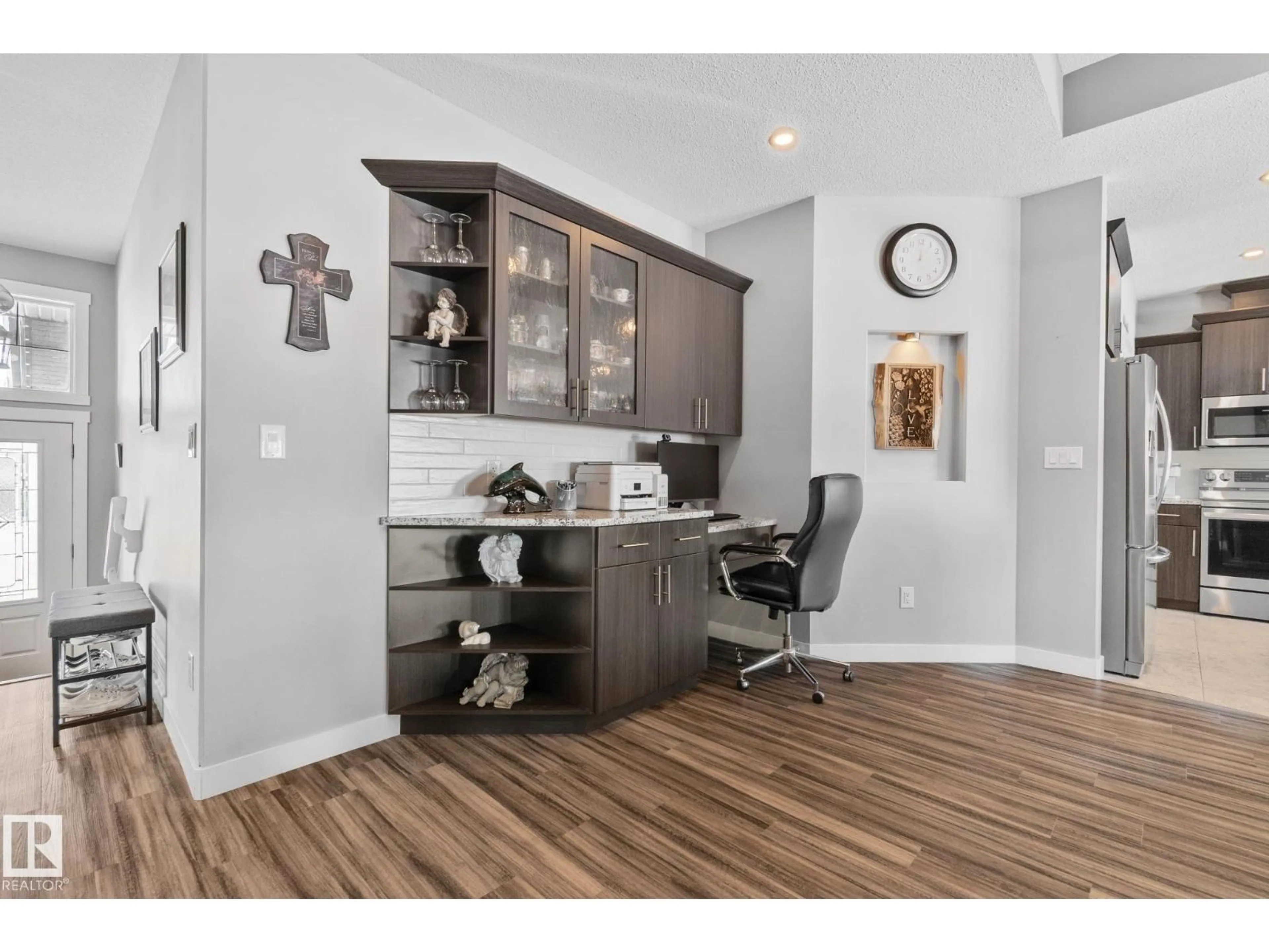 Open concept kitchen, wood/laminate floor for 105 HOULE DR, Morinville Alberta T8R0E1