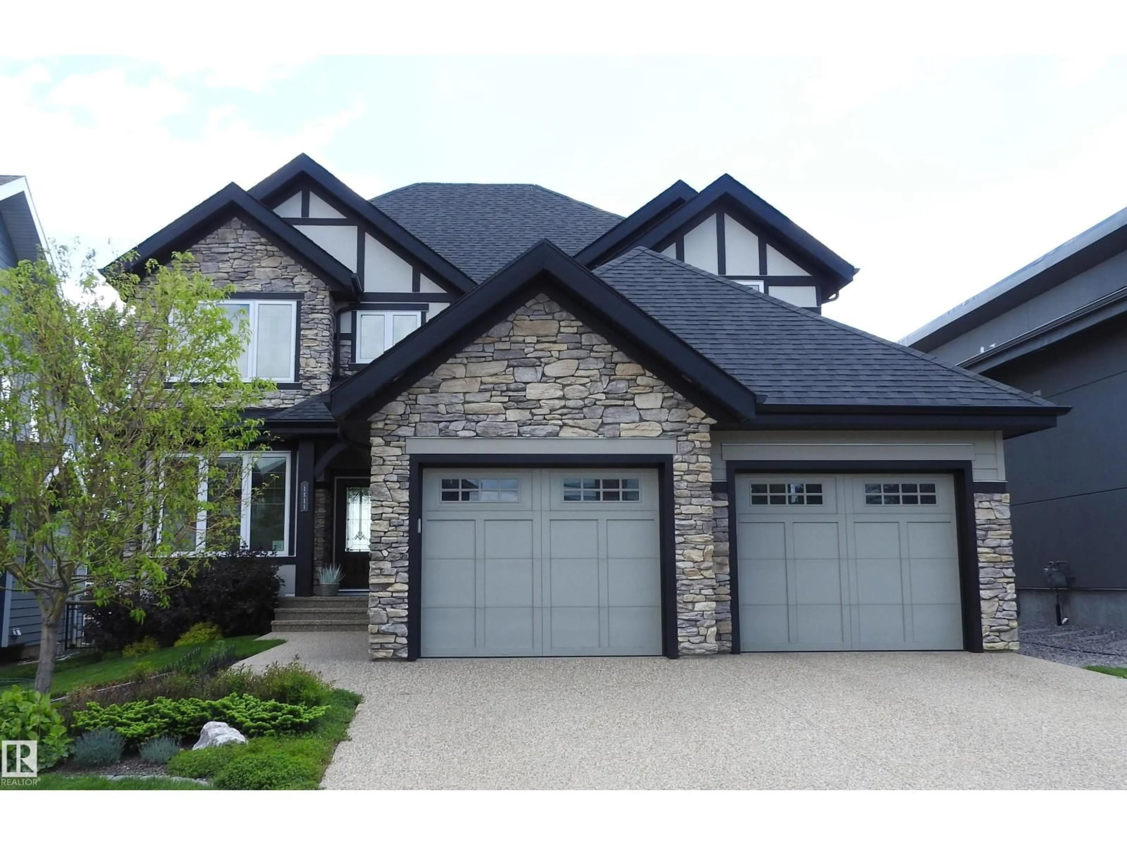 Home with vinyl exterior material, street for 1111 HAINSTOCK GREEN, Edmonton Alberta T6W2T8