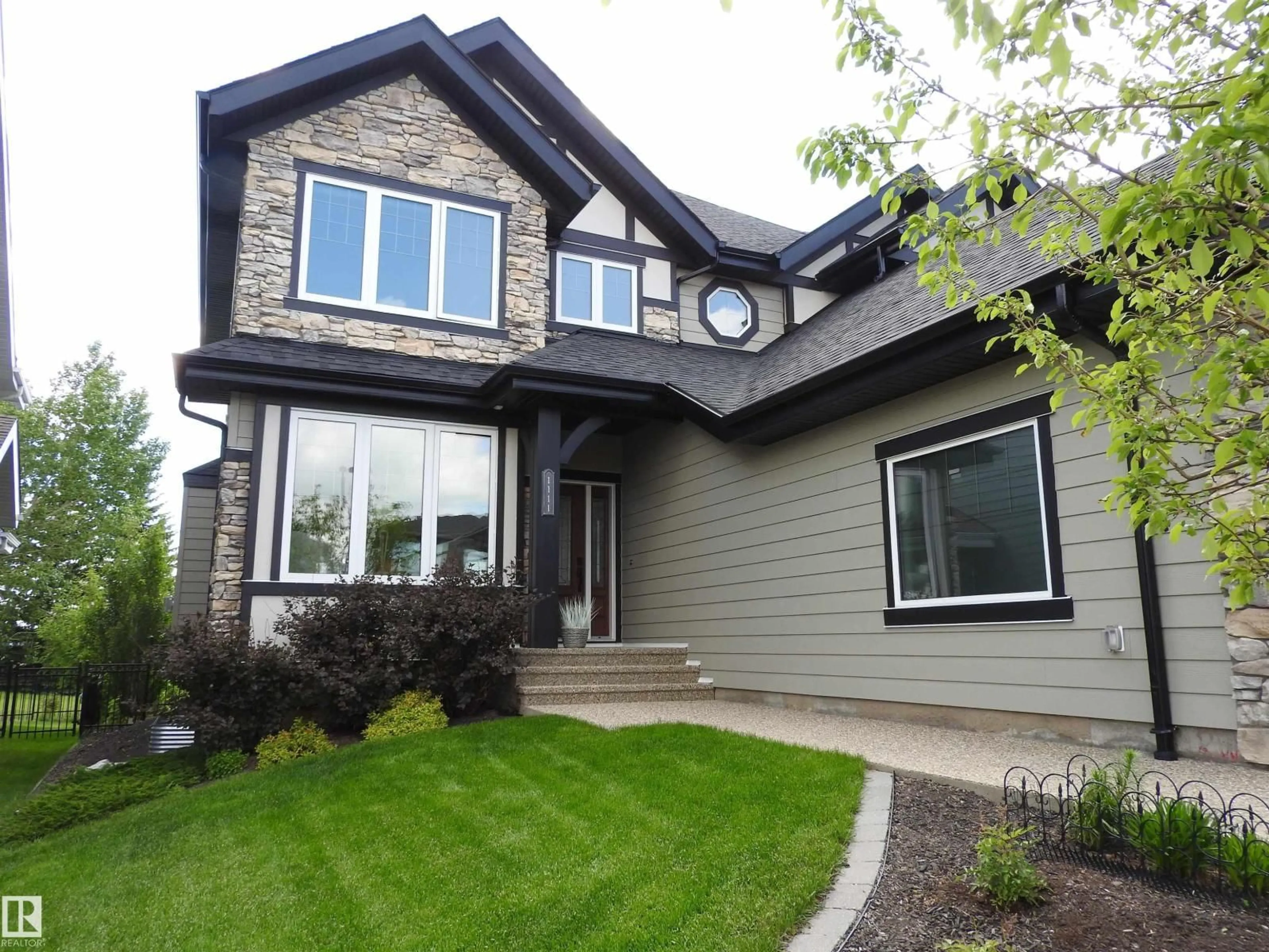 Home with vinyl exterior material, street for 1111 HAINSTOCK GREEN, Edmonton Alberta T6W2T8