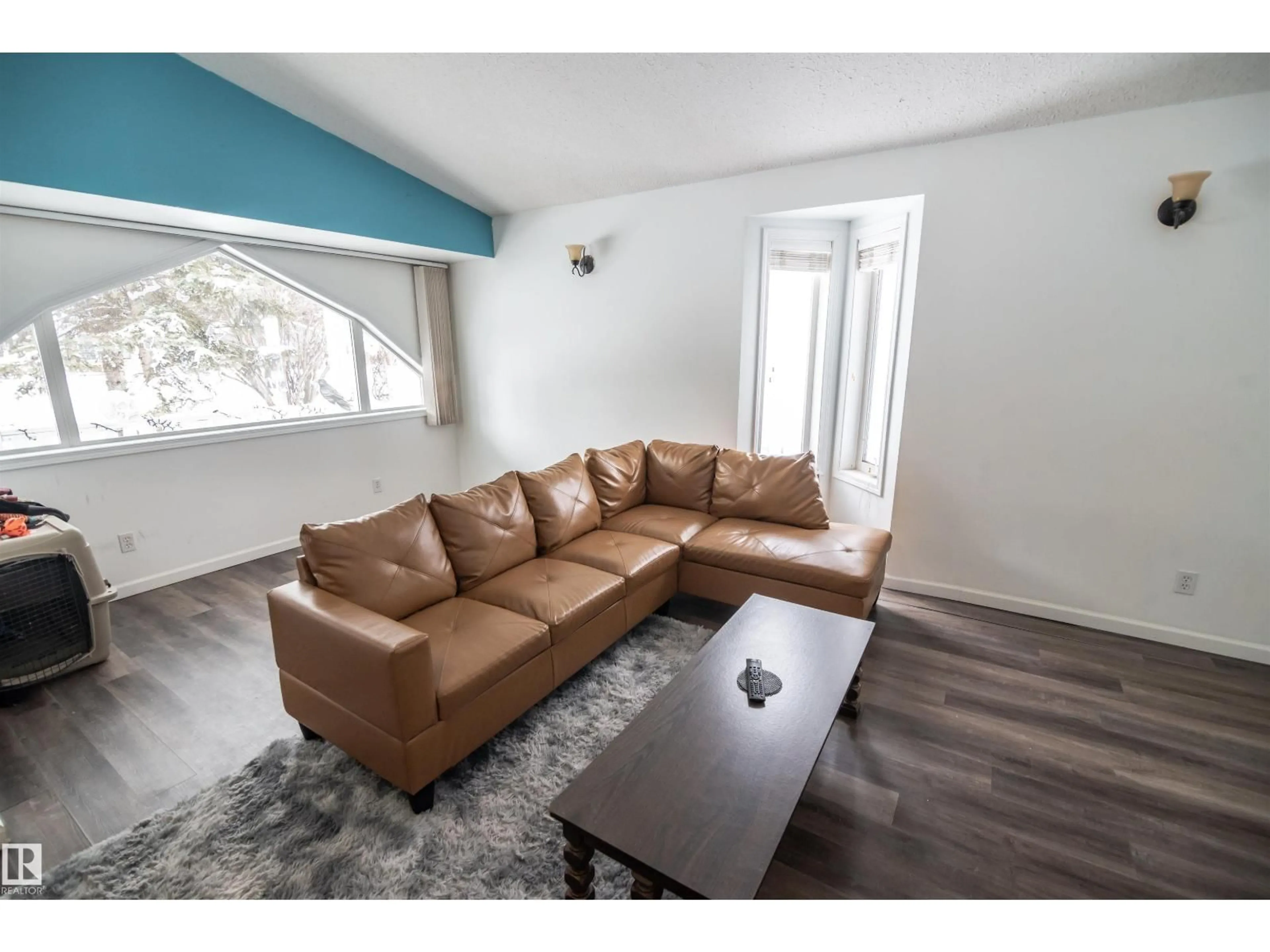 Living room with furniture, wood/laminate floor for 4727 52A ST, Rural Lac Ste. Anne County Alberta T0E0A0