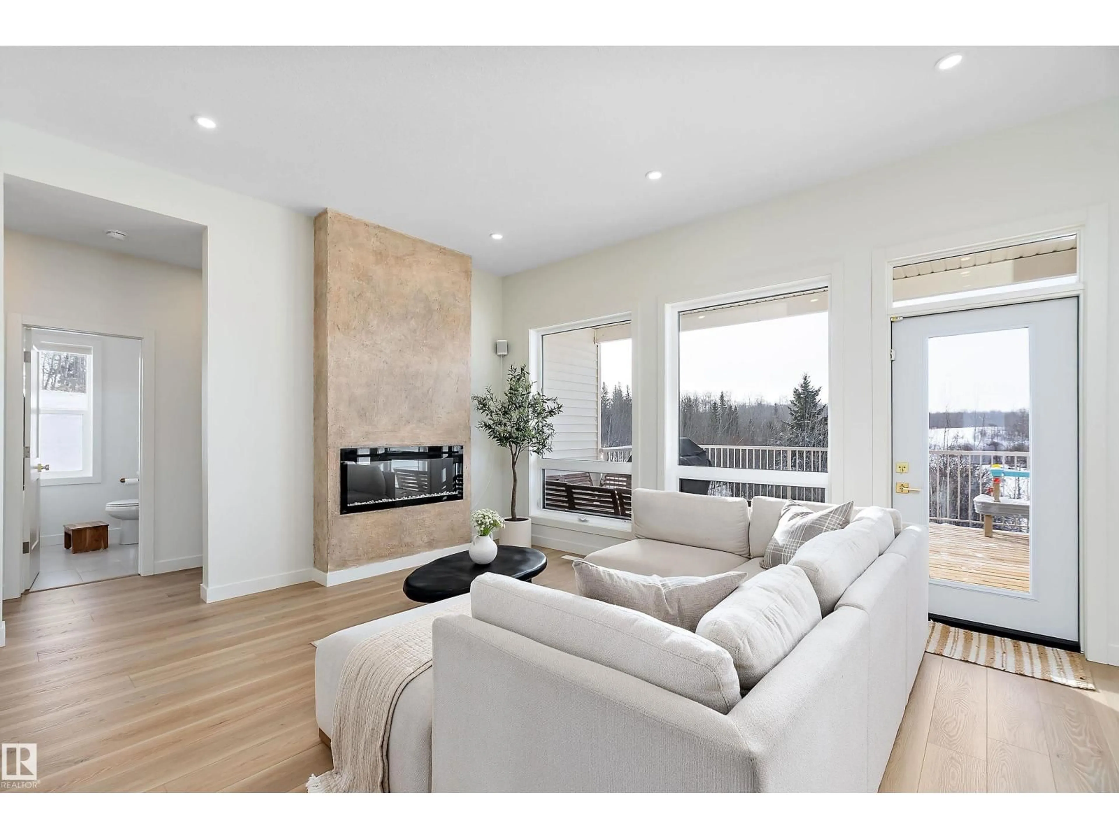 Living room with furniture, wood/laminate floor for 50408 - 13 RR 203, Rural Beaver County Alberta T0B4J2