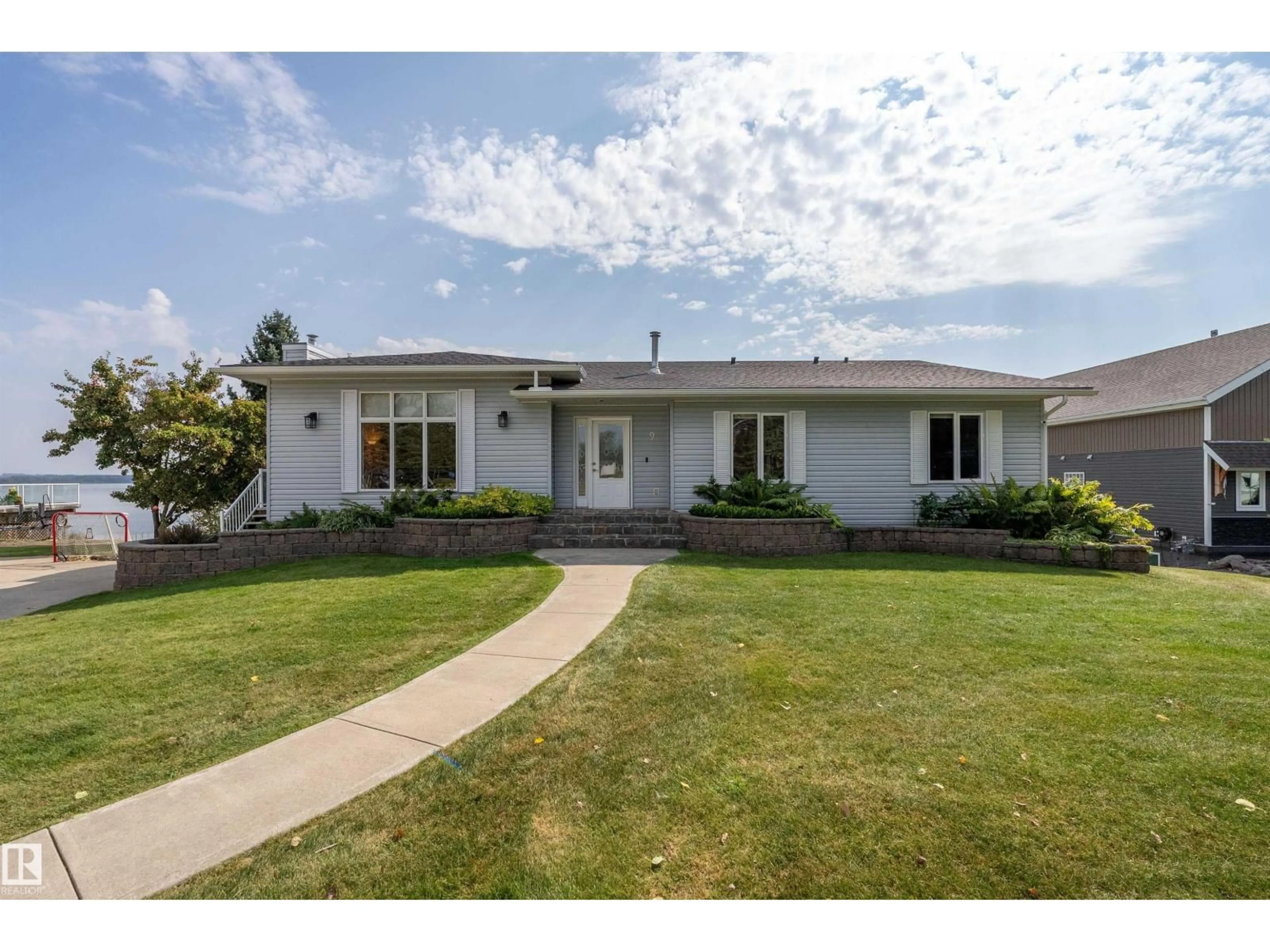 Home with vinyl exterior material, street for A - 62001 TWP ROAD 462, Rural Wetaskiwin County Alberta T0C2X0