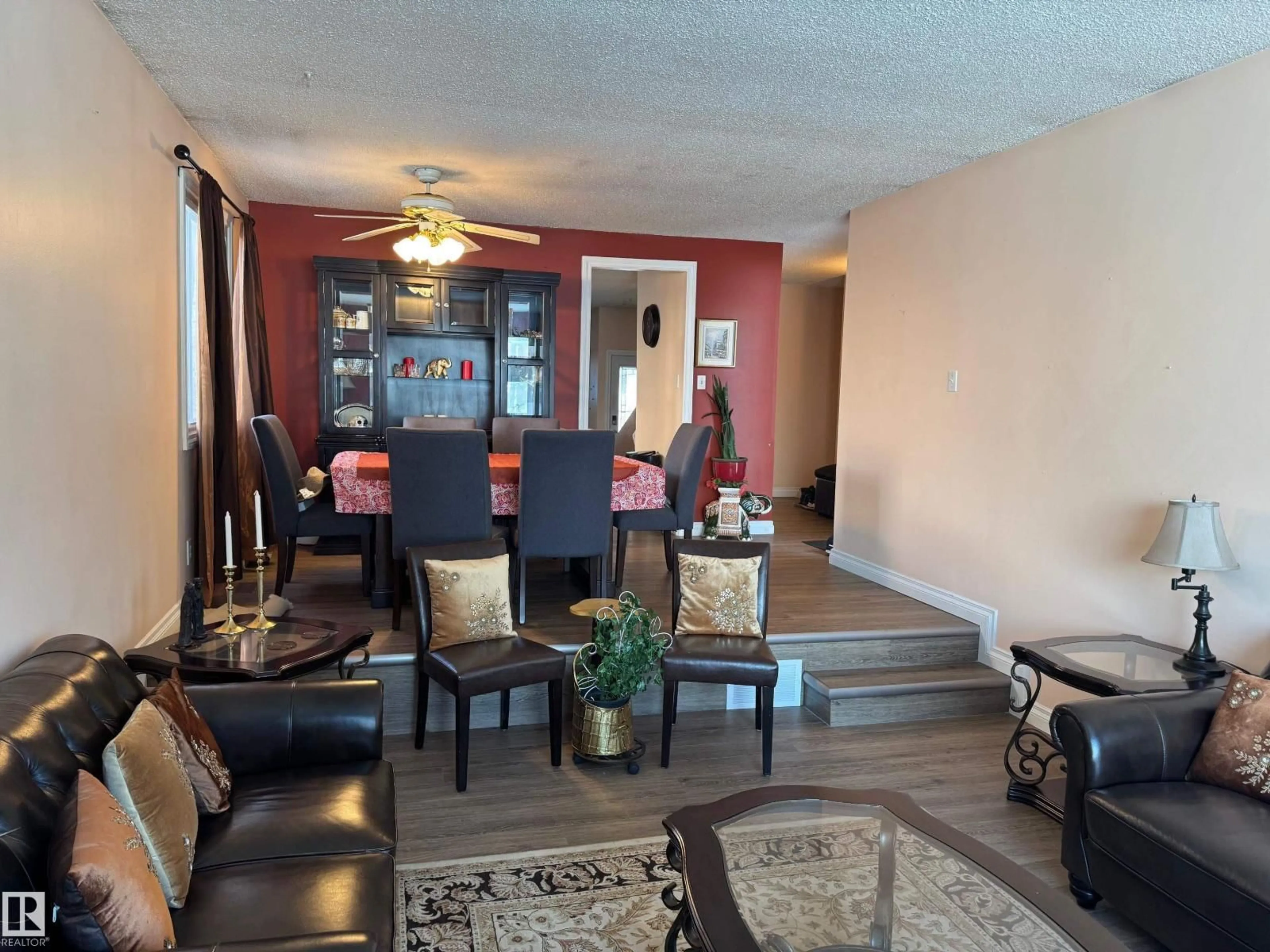 Living room with furniture, wood/laminate floor for 3203 74 ST, Edmonton Alberta T6K1J7