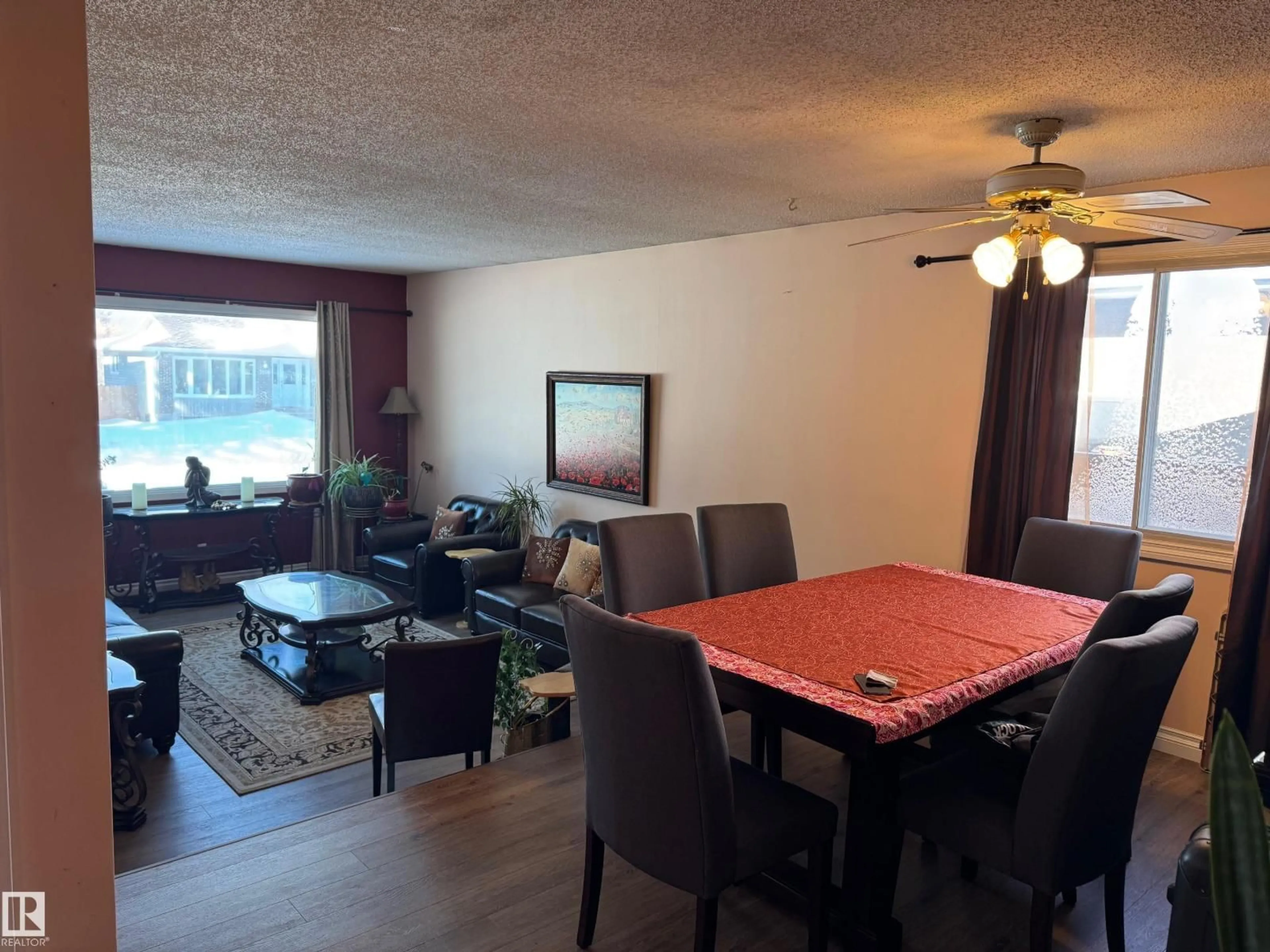 Living room with furniture, wood/laminate floor for 3203 74 ST, Edmonton Alberta T6K1J7