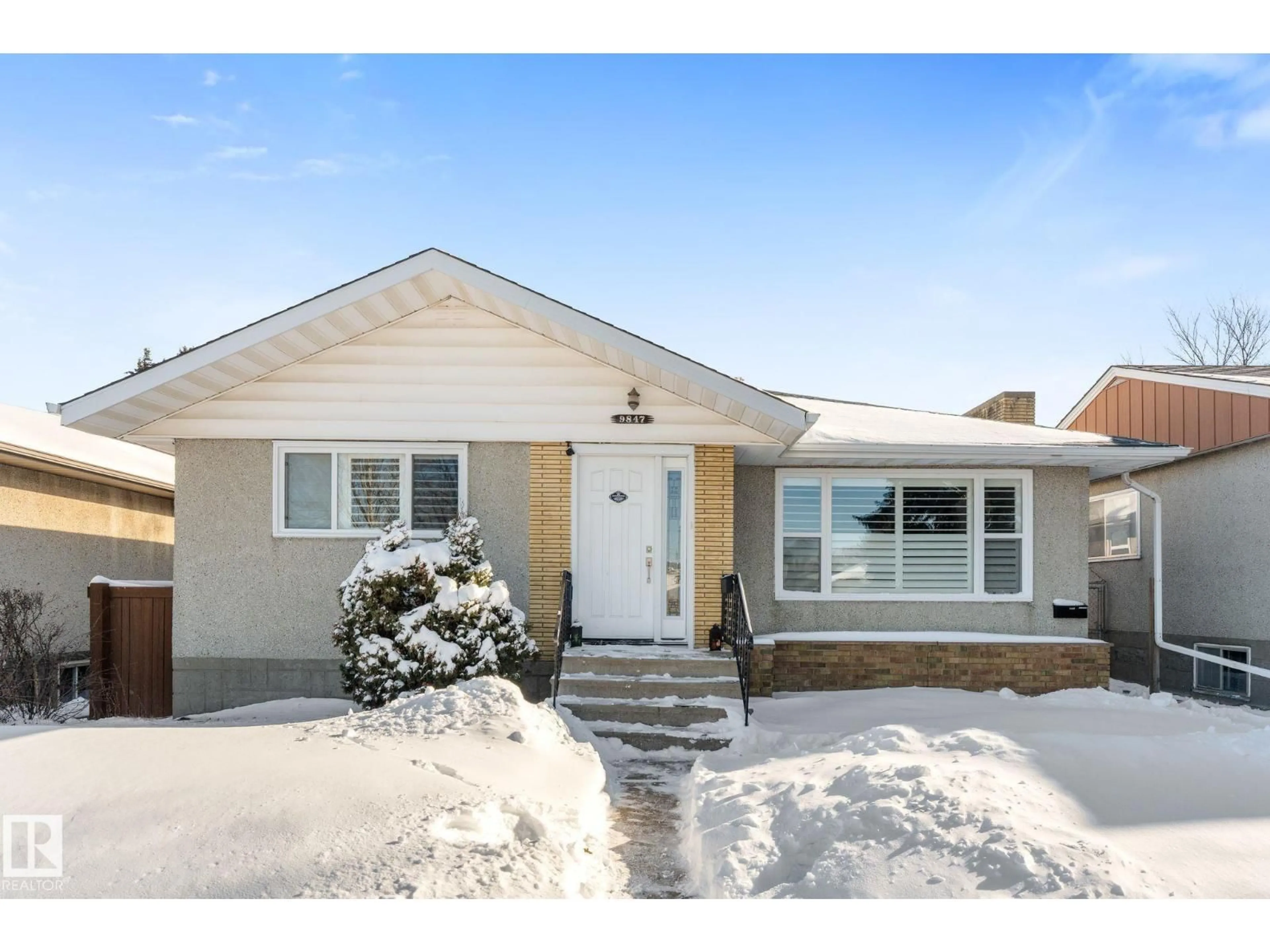 Home with vinyl exterior material, street for NW - 9847 79 ST, Edmonton Alberta T6A3G2