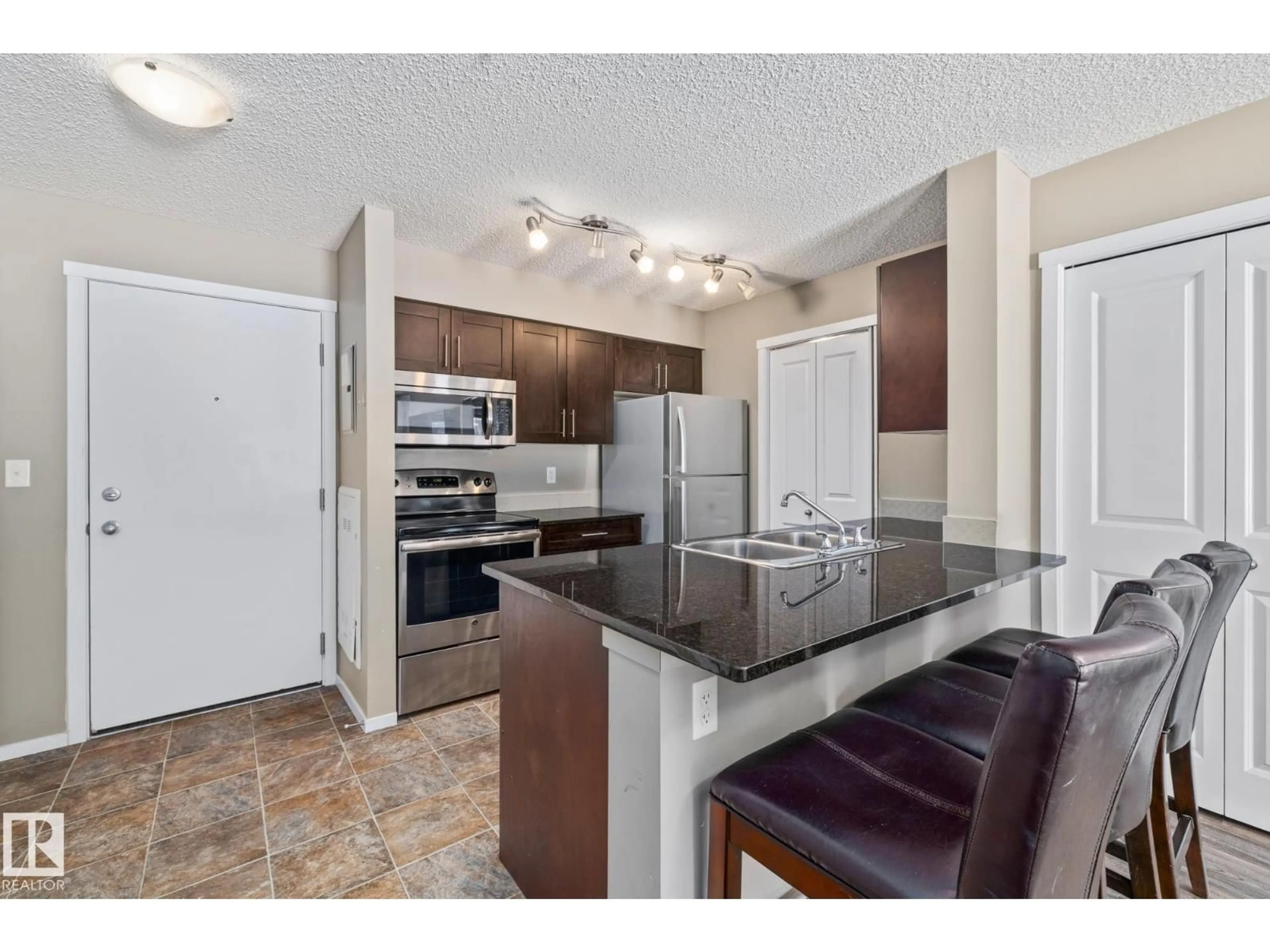Open concept kitchen, unknown for #109 - 5370 CHAPPELLE RD, Edmonton Alberta T6W3L5