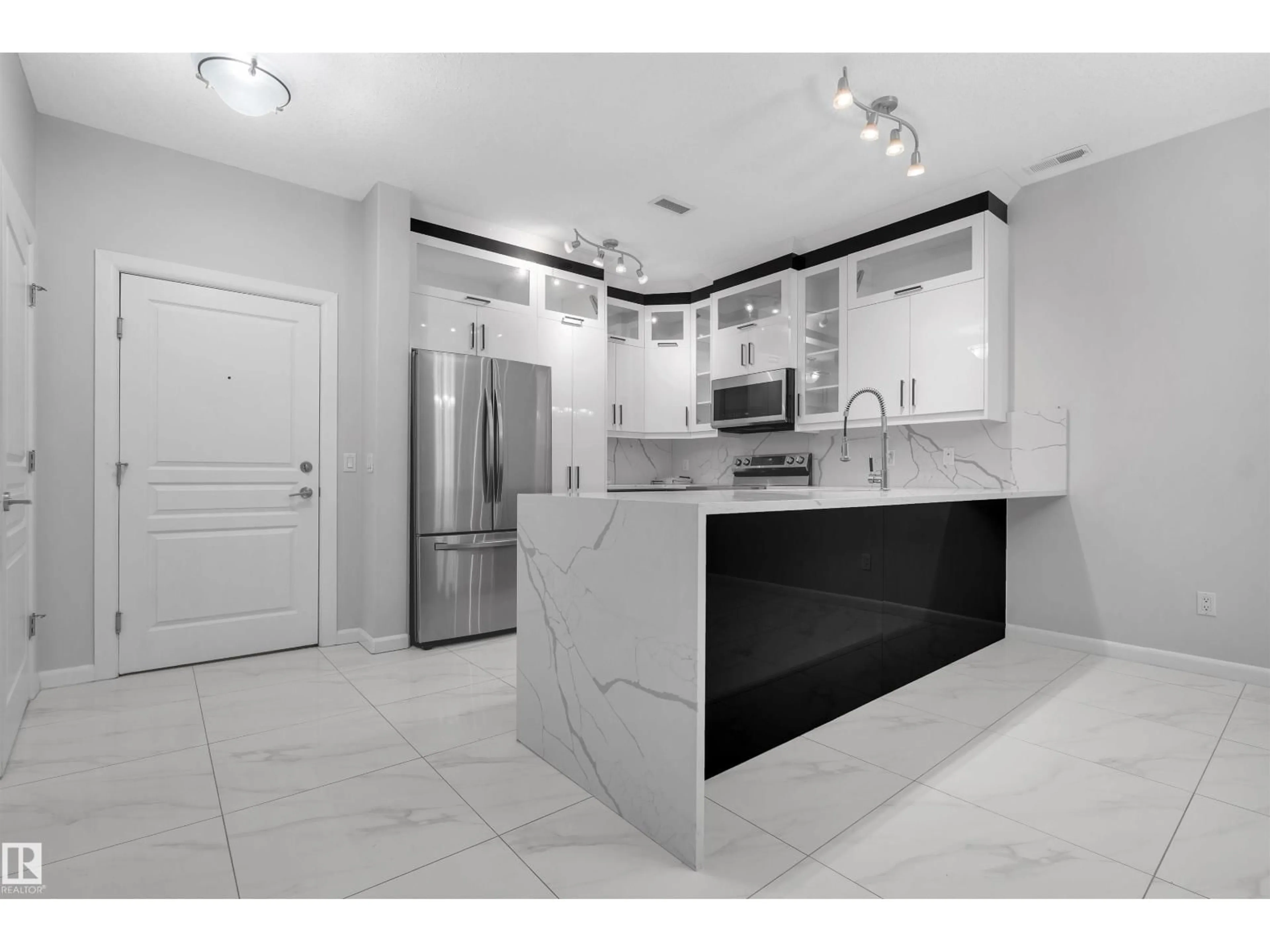 Open concept kitchen, ceramic/tile floor for #105 - 160 MAGRATH RD, Edmonton Alberta T6R3T7