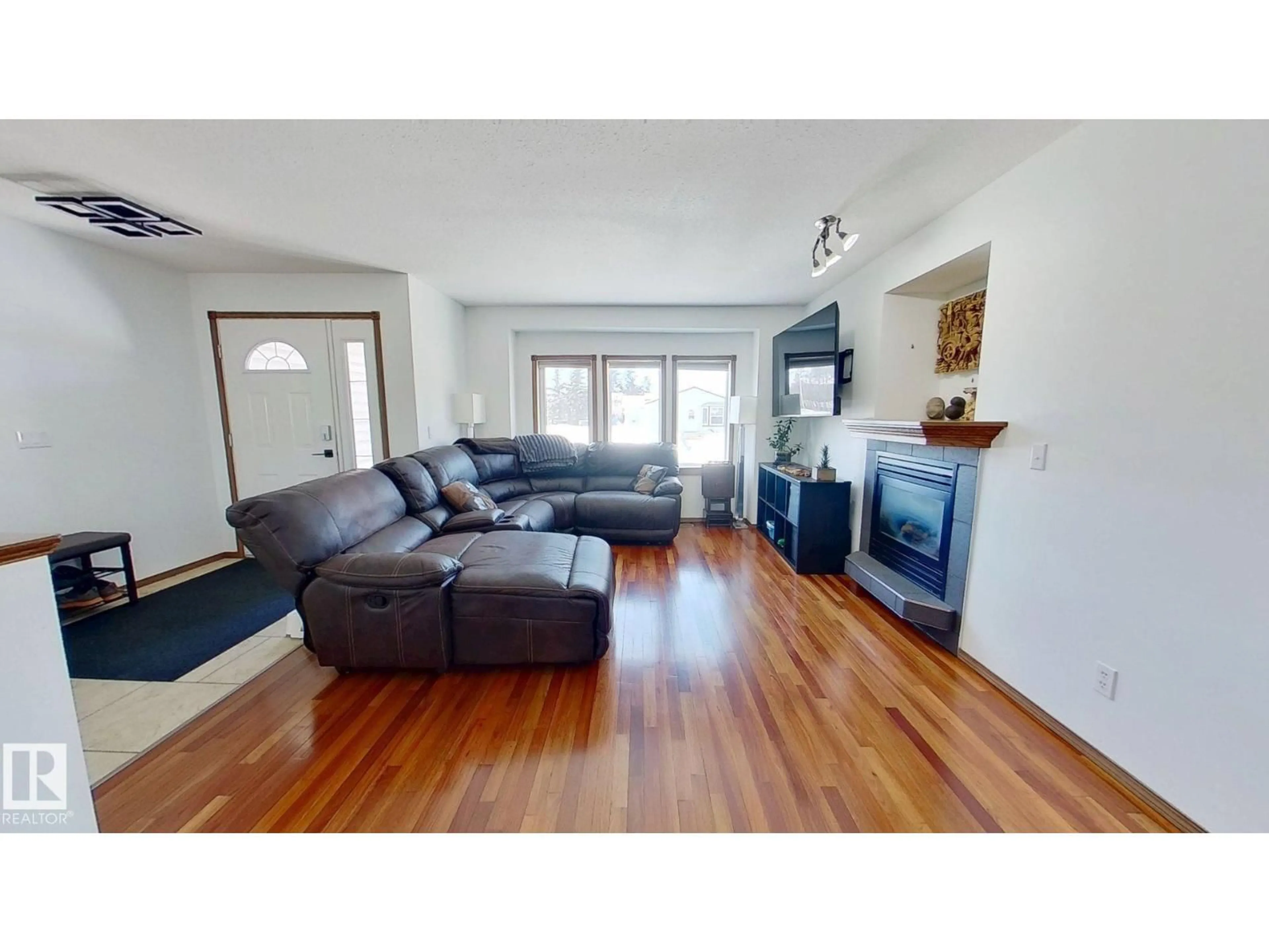 Living room with furniture, wood/laminate floor for 5322 55 AV, Bashaw Alberta T0B0H0