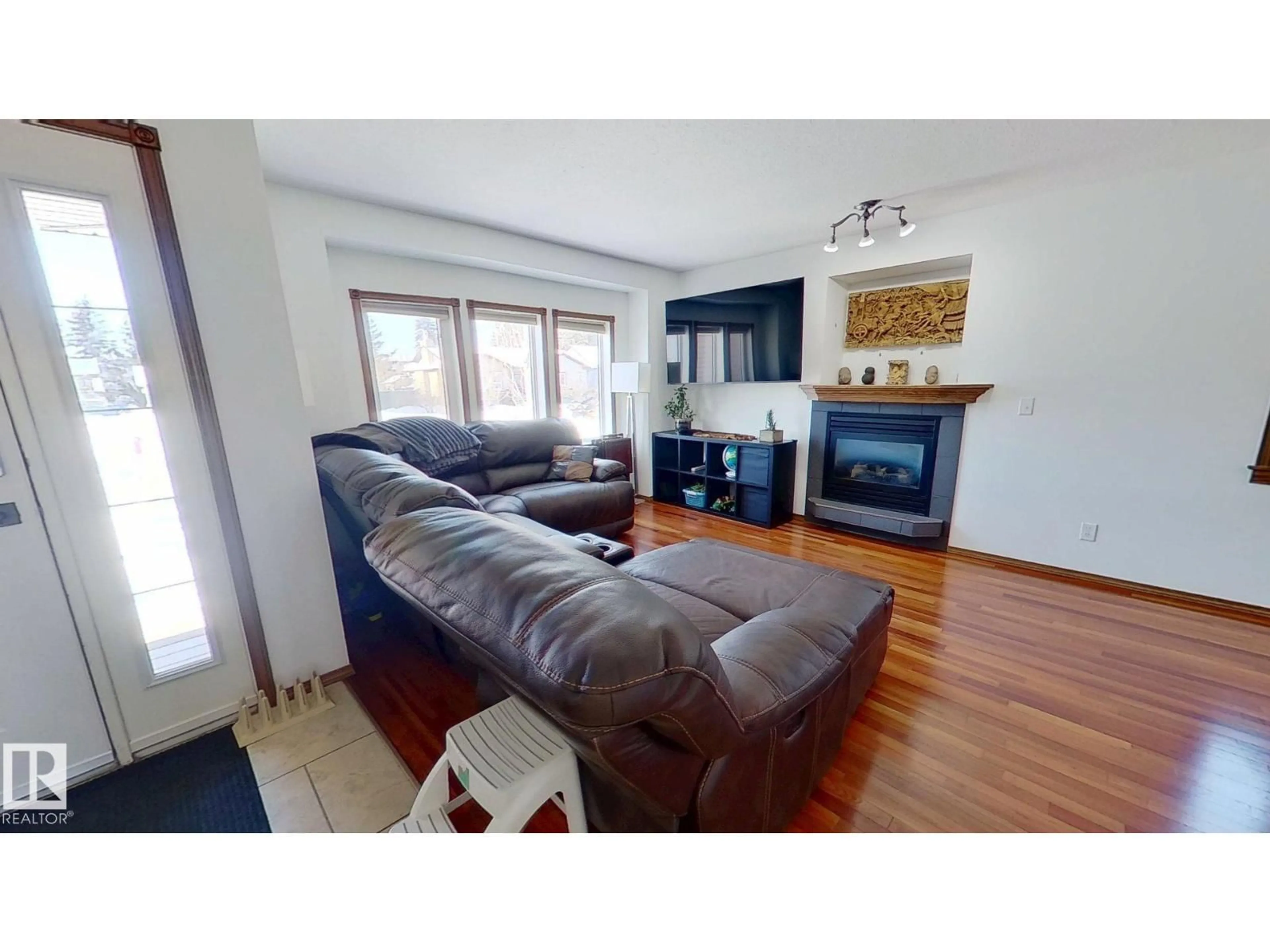 Living room with furniture, wood/laminate floor for 5322 55 AV, Bashaw Alberta T0B0H0