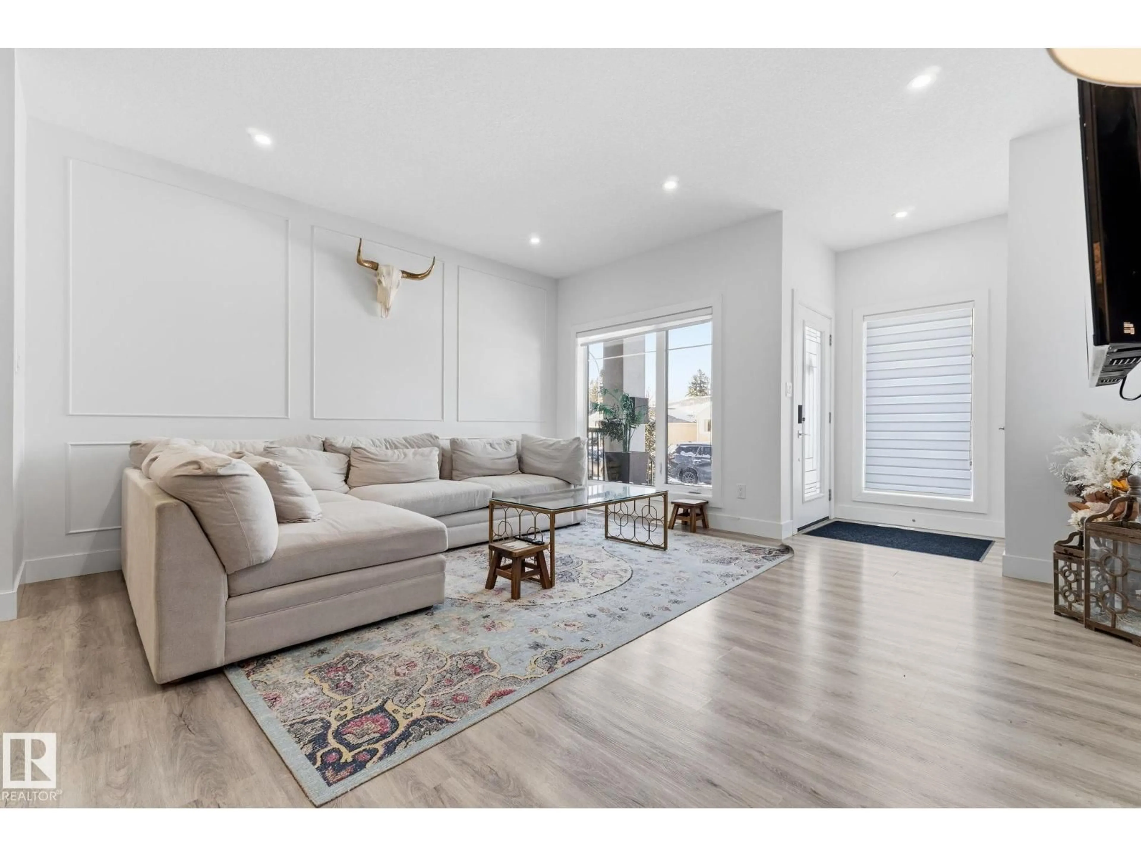 Living room with furniture, wood/laminate floor for NW - 9843 153 ST, Edmonton Alberta T5P2A6