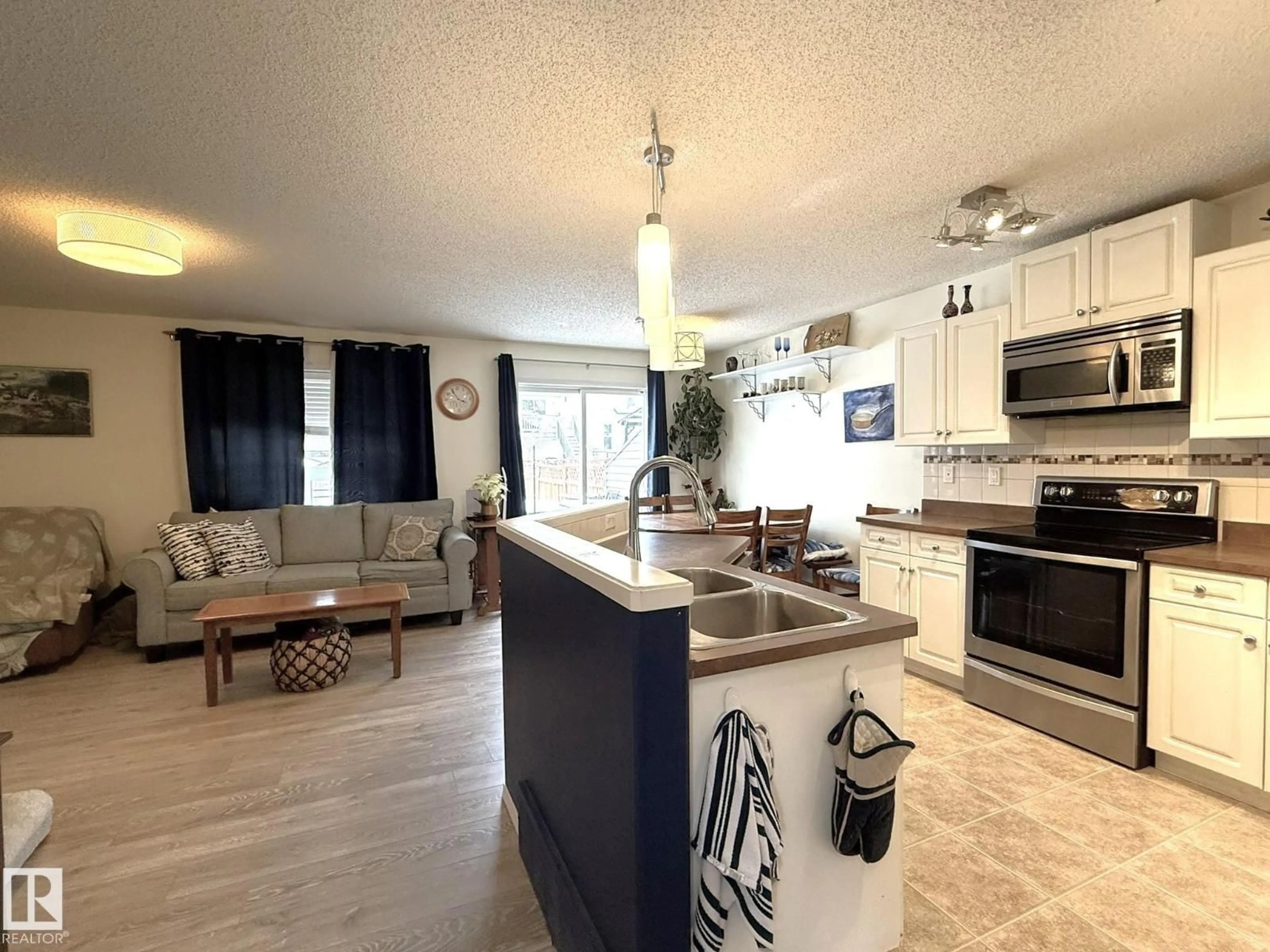 Open concept kitchen, unknown for 735 KANANASKIS DR, Devon Alberta T9G2G7