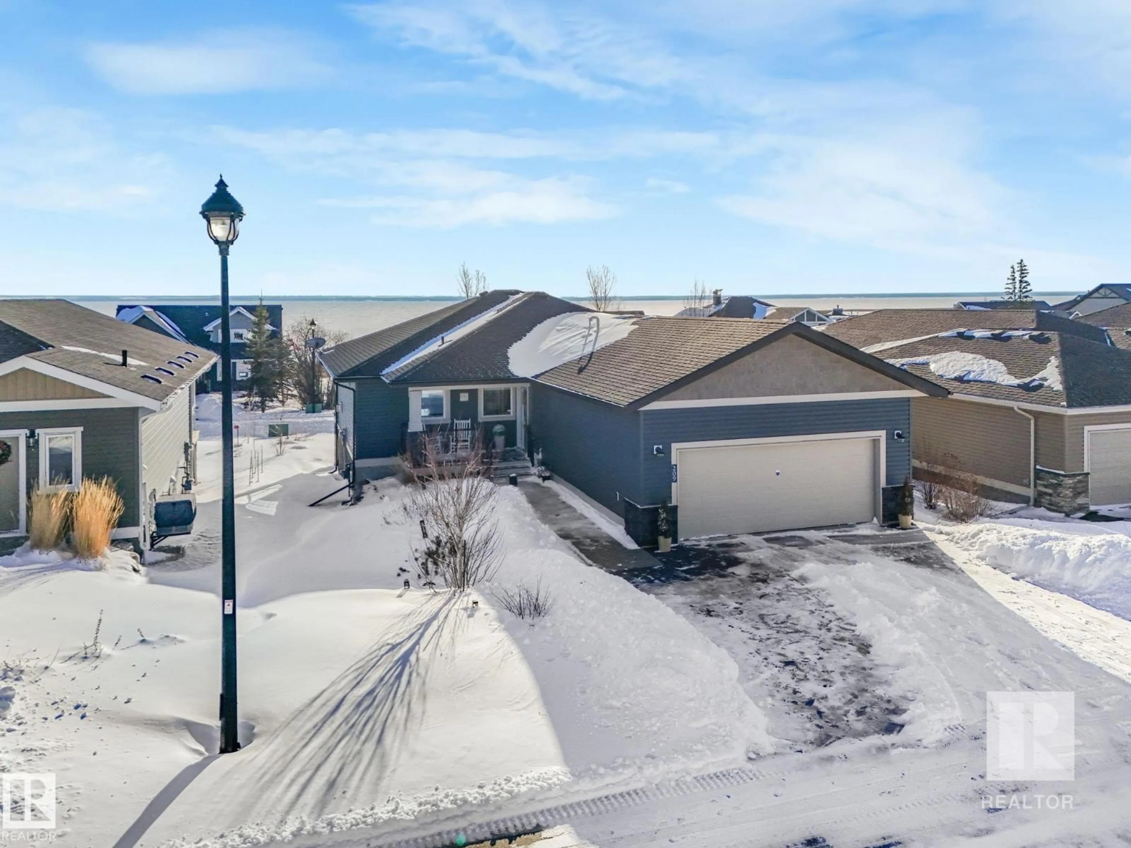 A pic from outside/outdoor area/front of a property/back of a property/a pic from drone, street for 209 - 55101 STE. ANNE TR, Rural Lac Ste. Anne County Alberta T0E1A1
