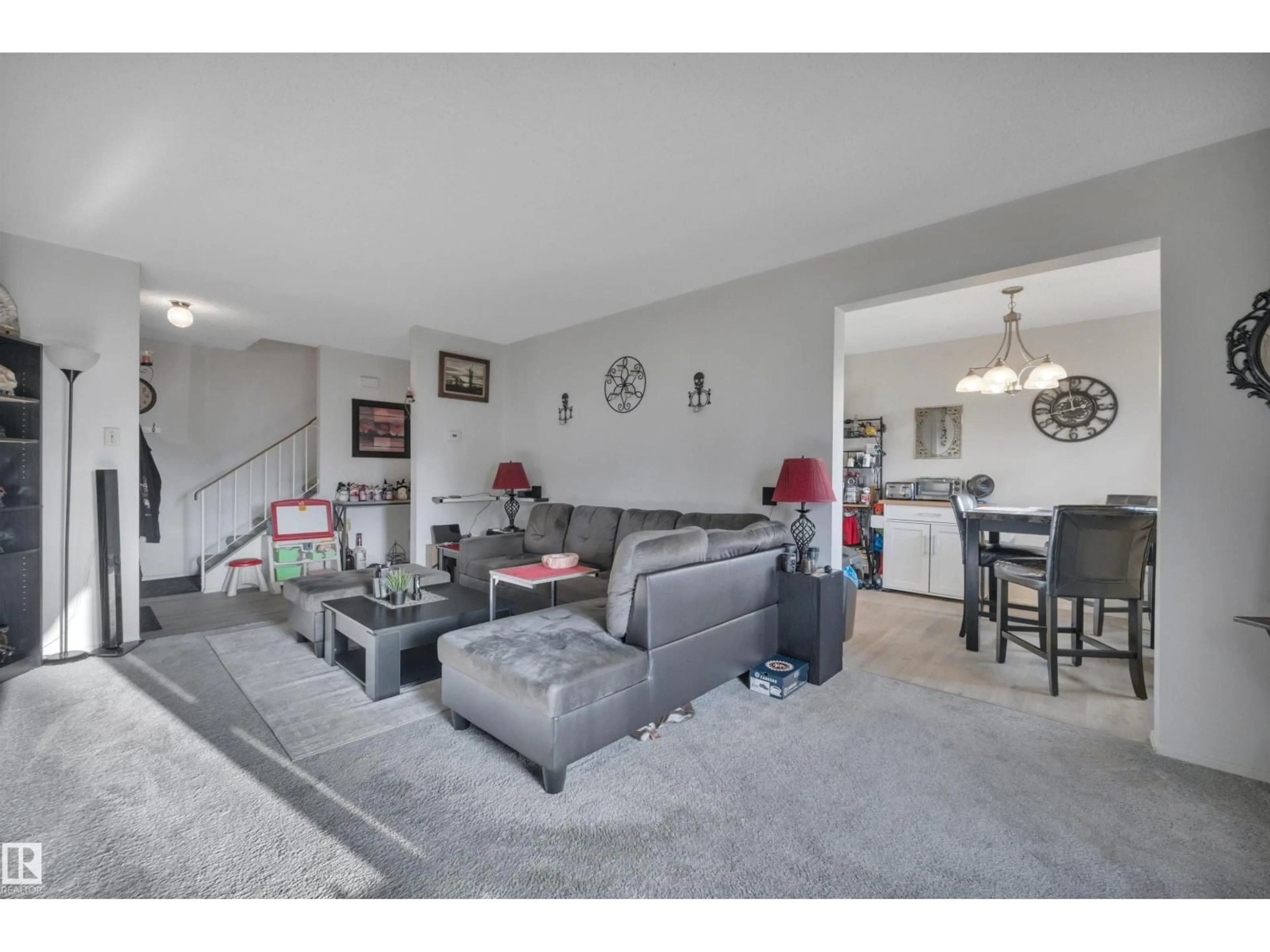 Living room with furniture, unknown for NW - 8216-8222 120 AV, Edmonton Alberta T5B0X9