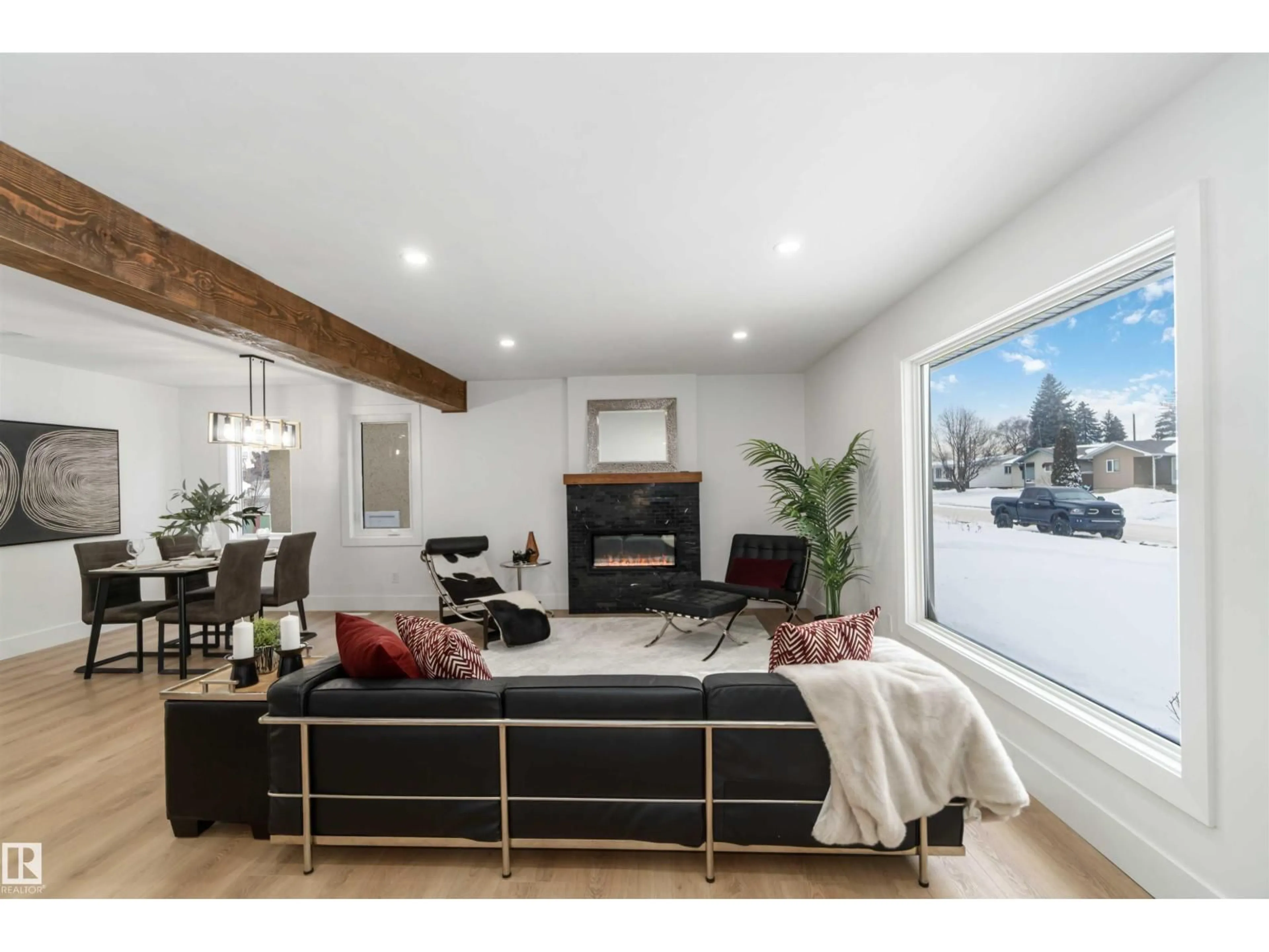 Living room with furniture, wood/laminate floor for 6719 95 AV, Edmonton Alberta T6B1A6