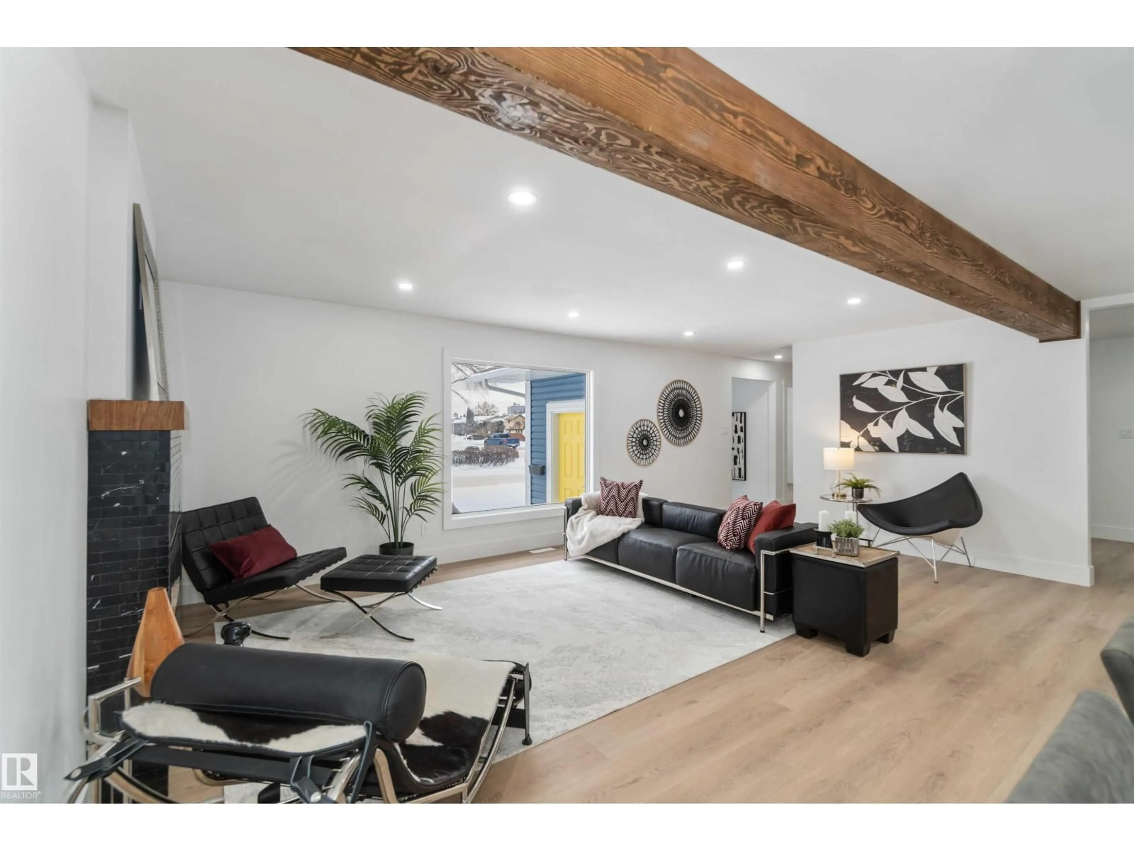 Living room with furniture, wood/laminate floor for 6719 95 AV, Edmonton Alberta T6B1A6