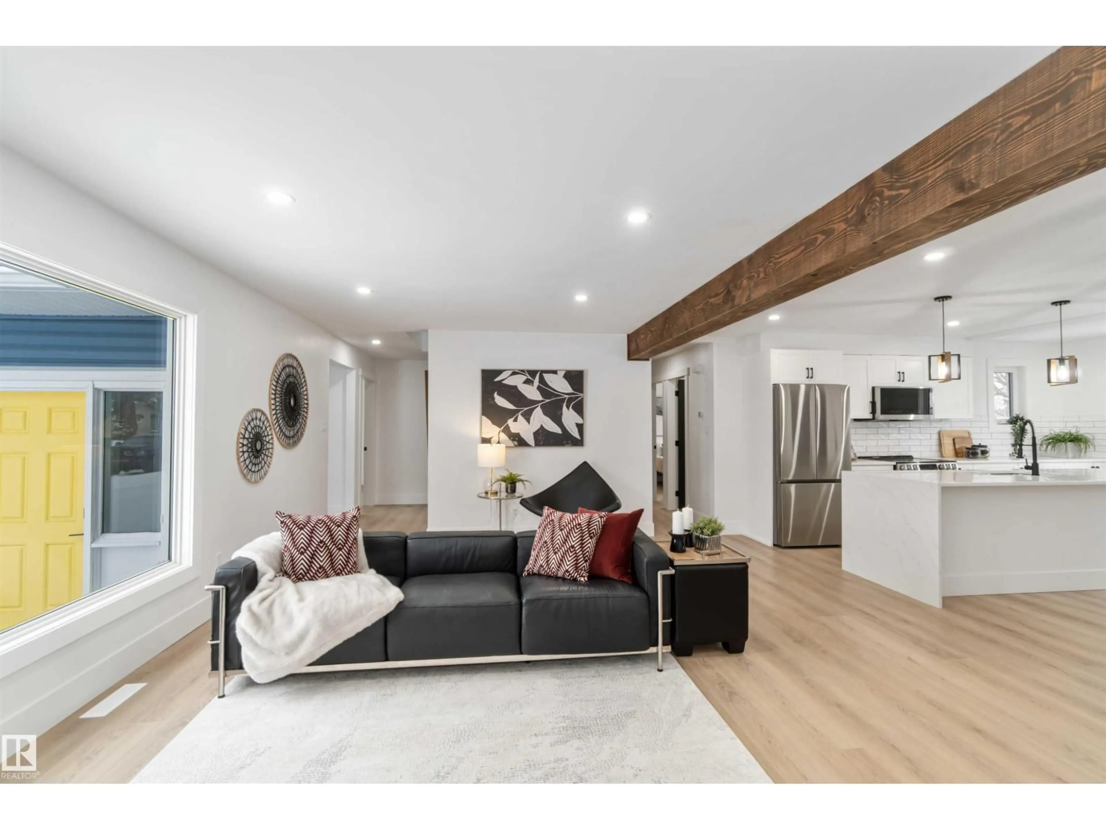 Living room with furniture, wood/laminate floor for 6719 95 AV, Edmonton Alberta T6B1A6