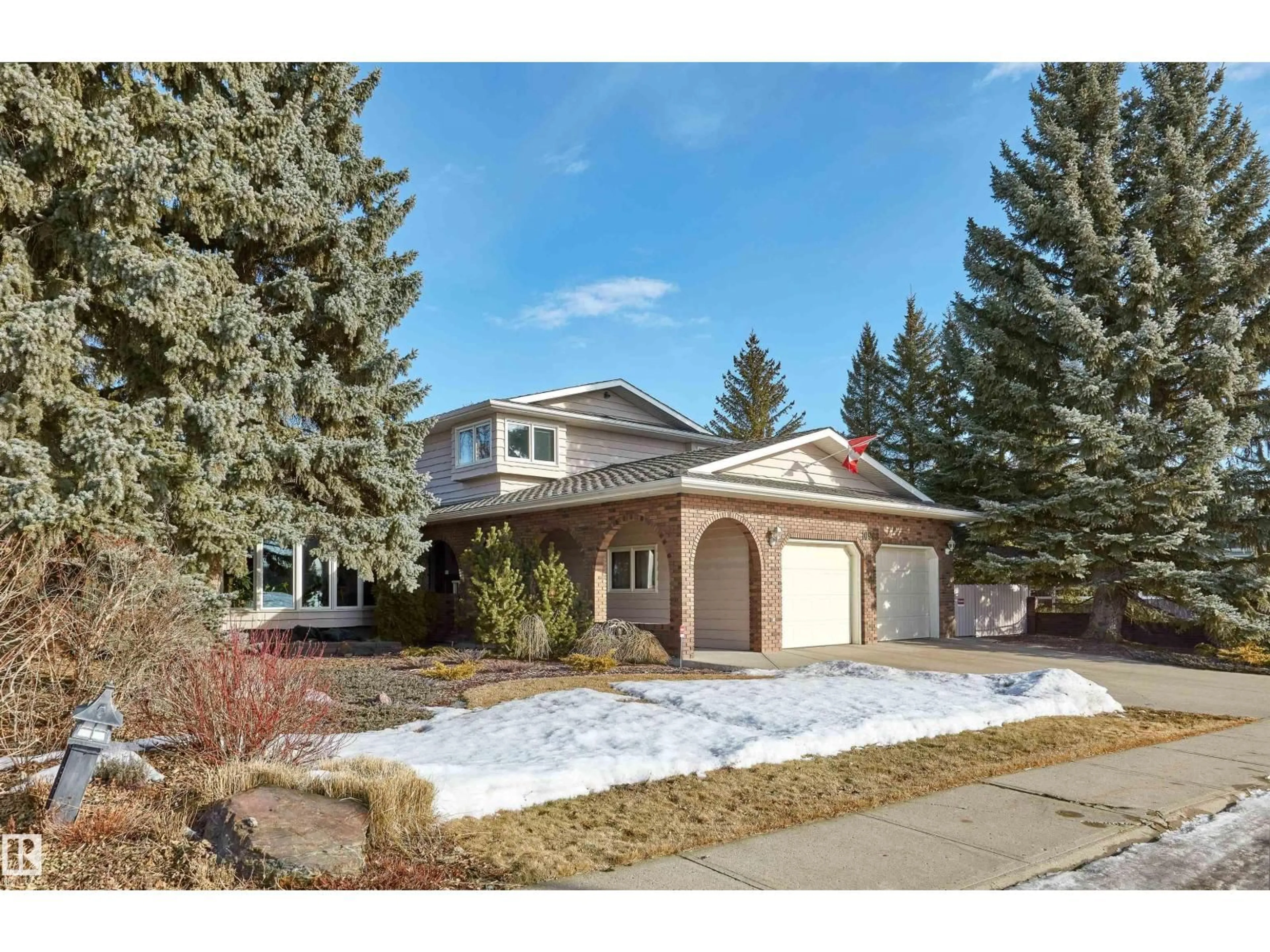 Home with vinyl exterior material, street for 10908 BEARSPAW DR, Edmonton Alberta T6J5B3