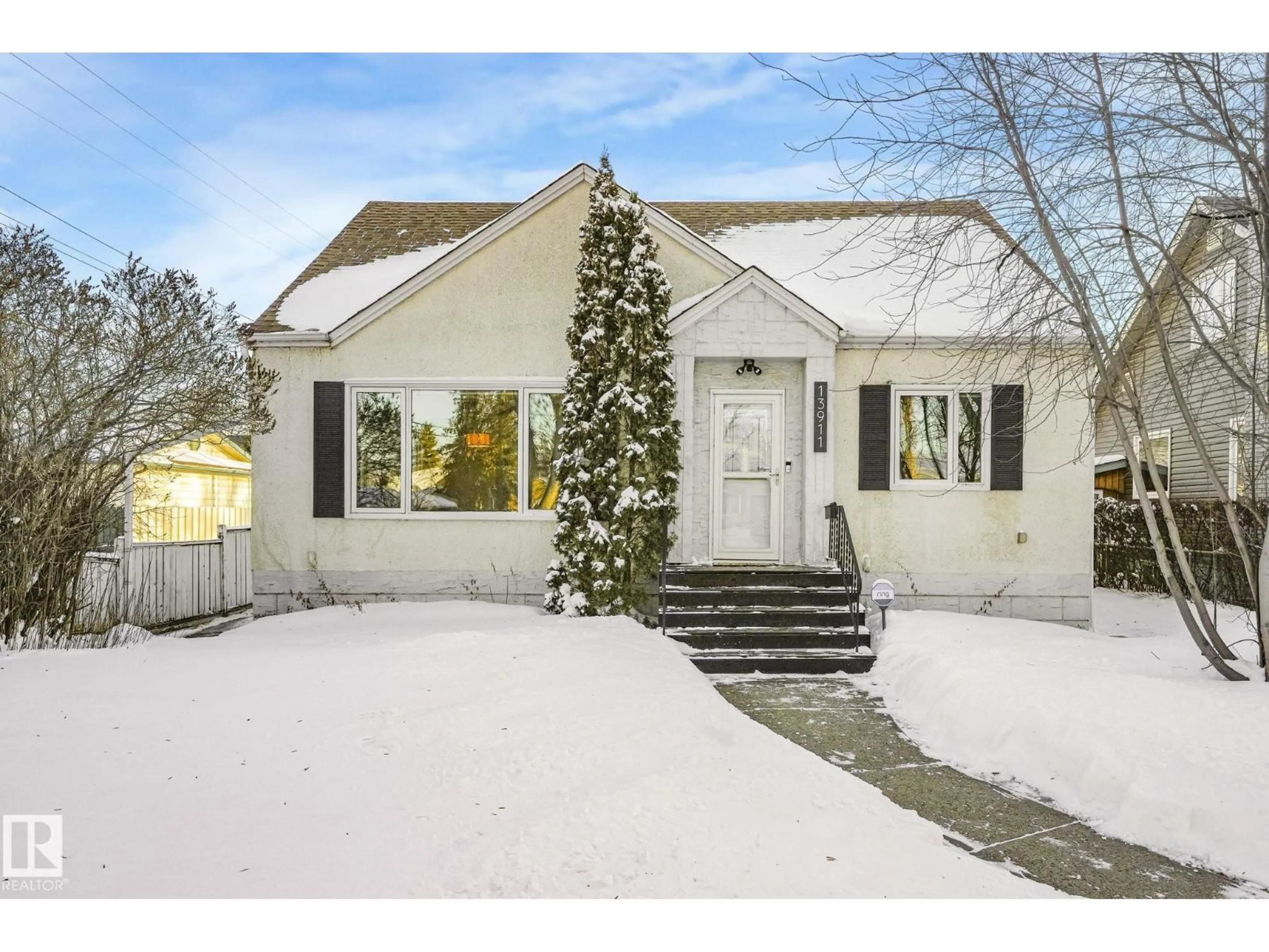 Home with vinyl exterior material, street for NW - 13911 117 AV, Edmonton Alberta T5M3J3