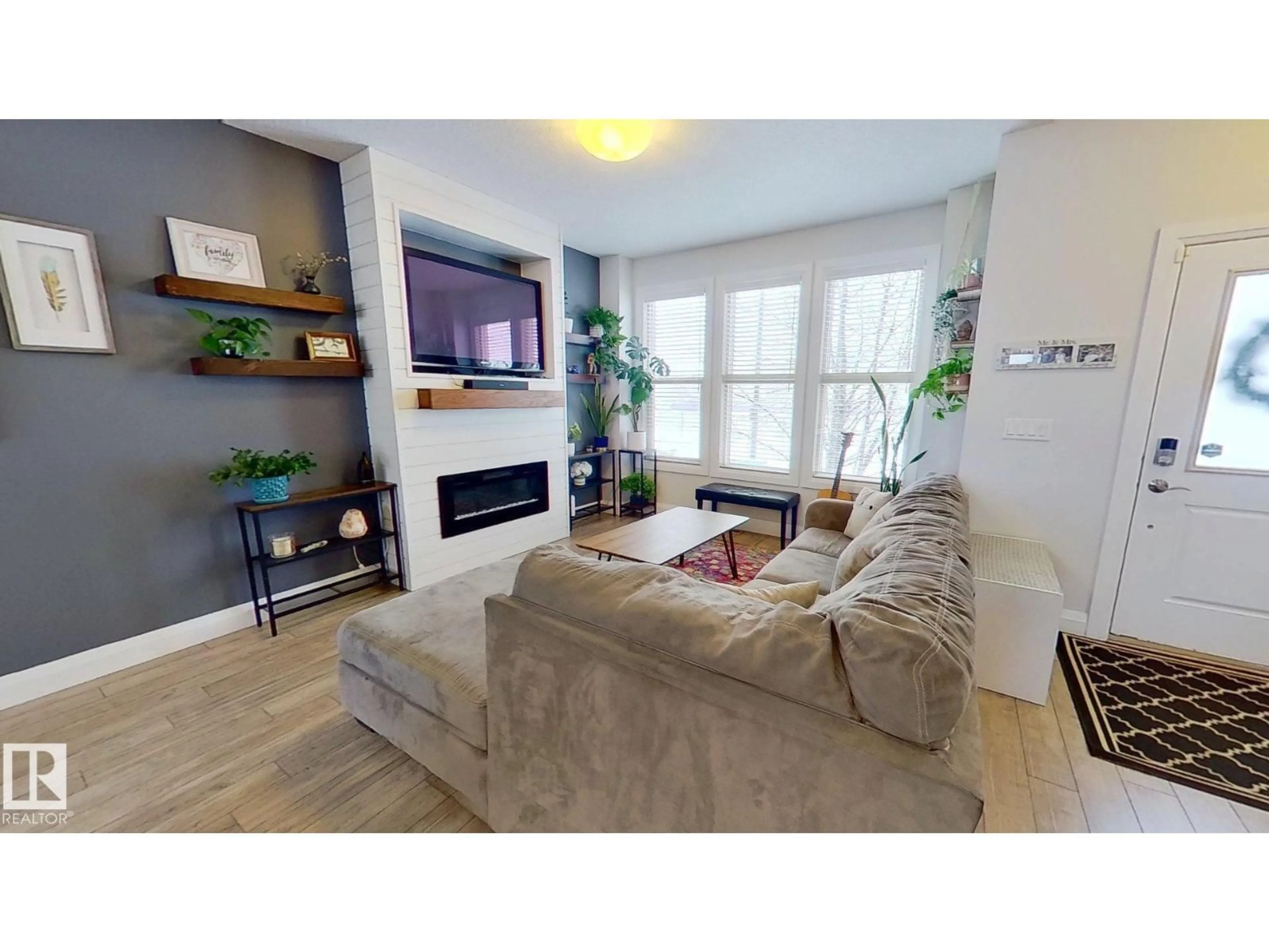 Living room with furniture, wood/laminate floor for 321 PIONEER RD, Spruce Grove Alberta T7X0T1