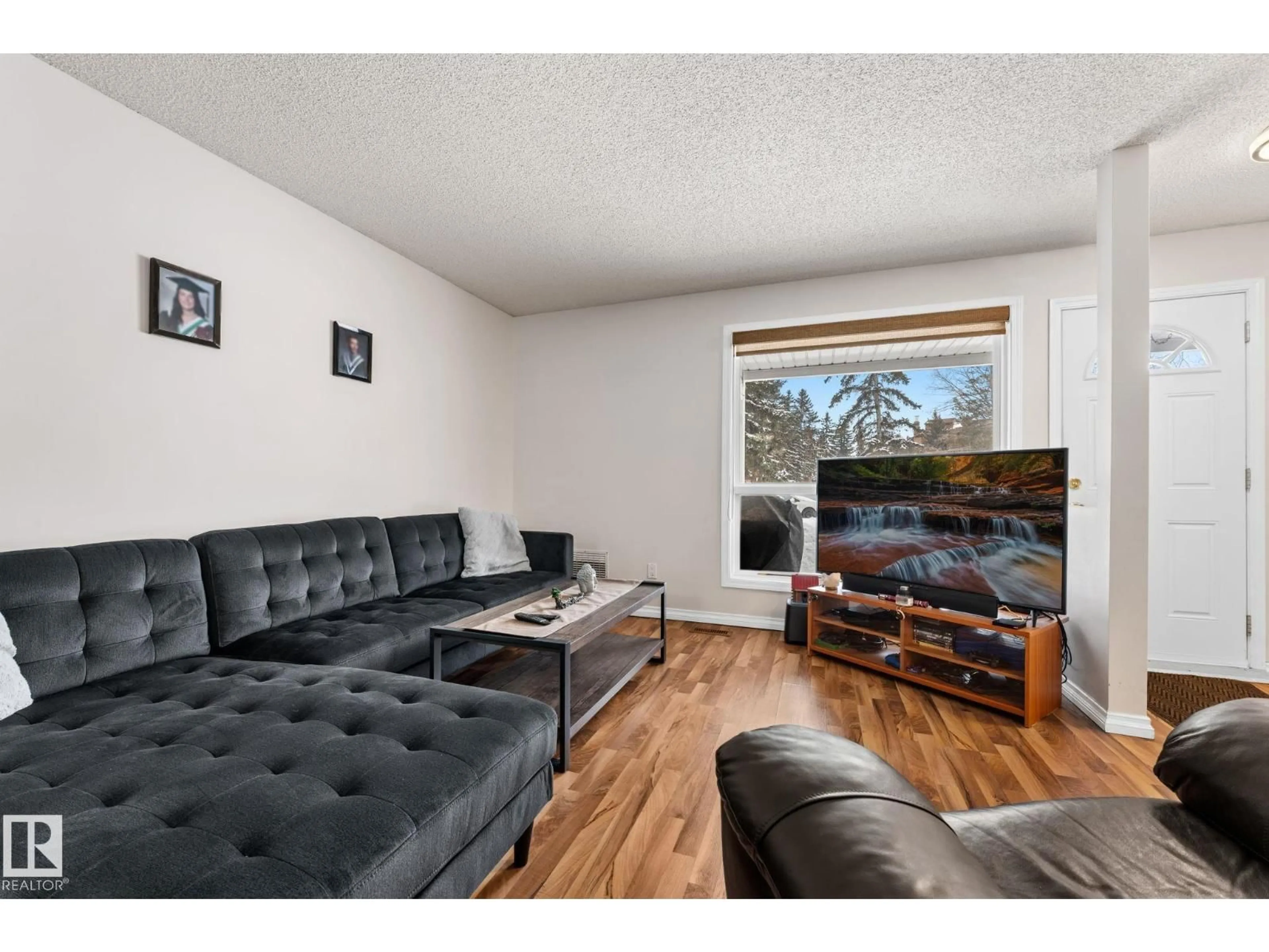 Living room with furniture, wood/laminate floor for 36 - 2204 118 ST, Edmonton Alberta T6J5K2