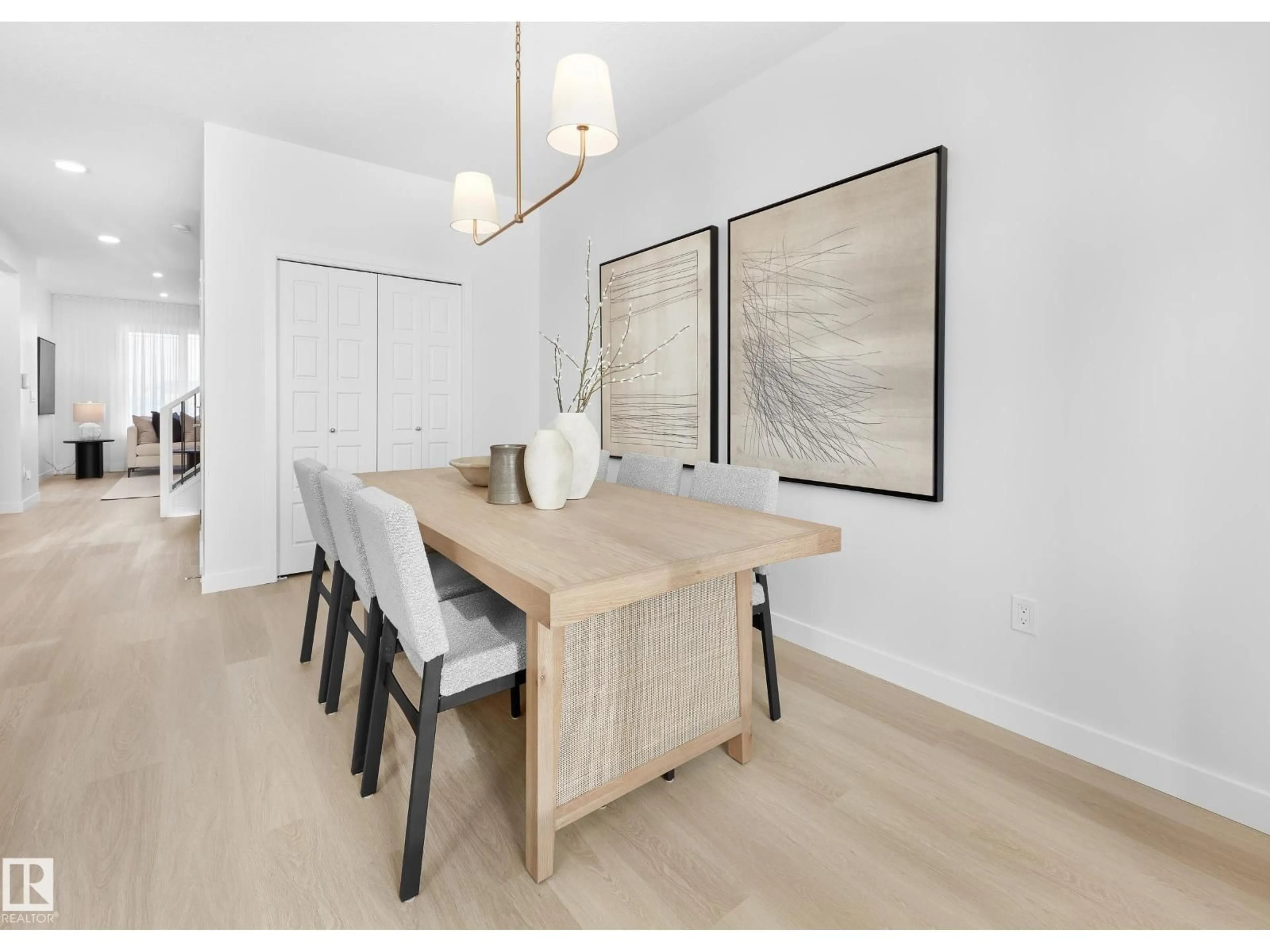 Dining room, wood/laminate floor for 2192 MUCKLEPLUM CR, Edmonton Alberta T6X3G8