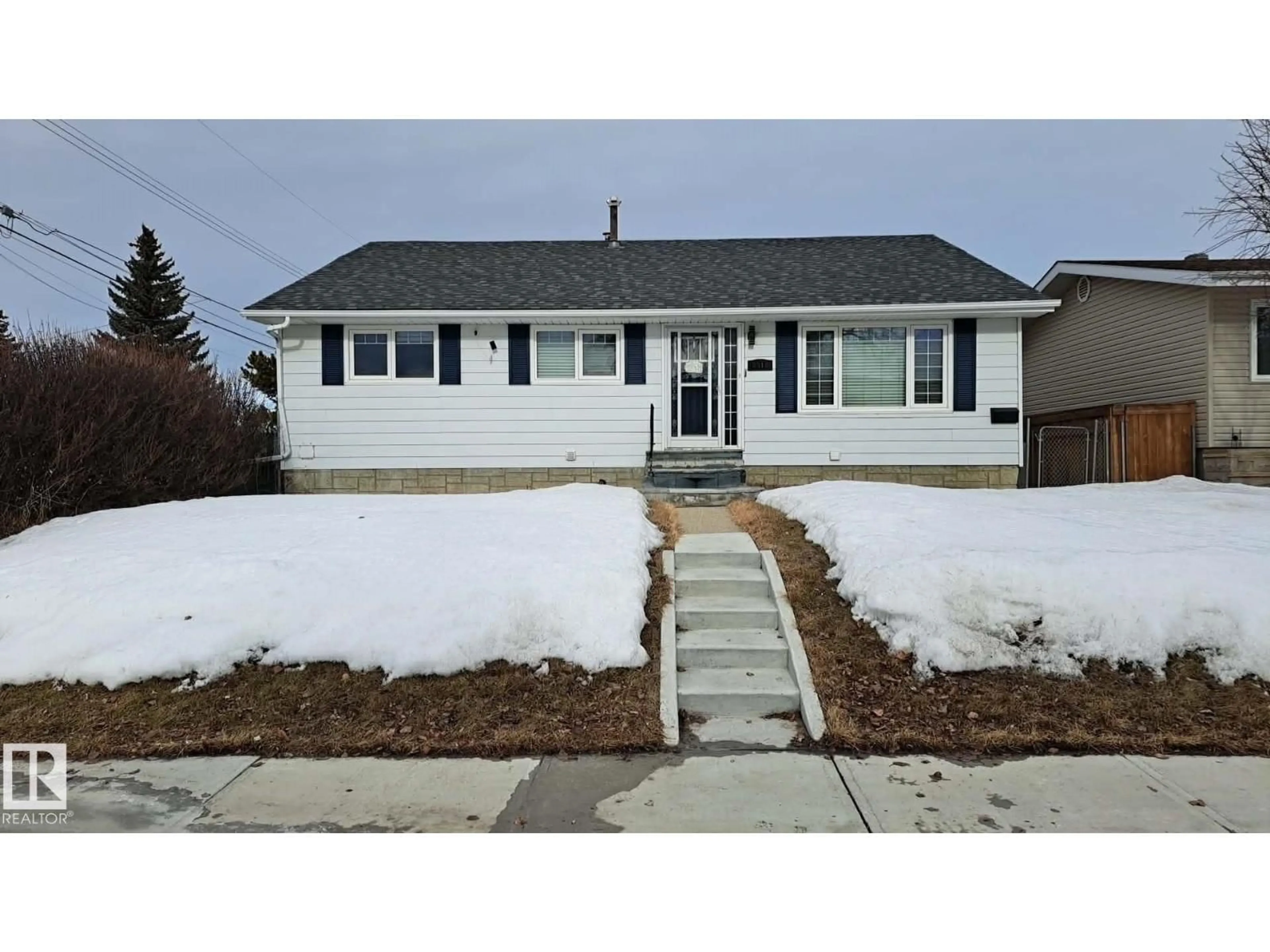 Home with vinyl exterior material, street for 8512 131 AV, Edmonton Alberta T5E0W2